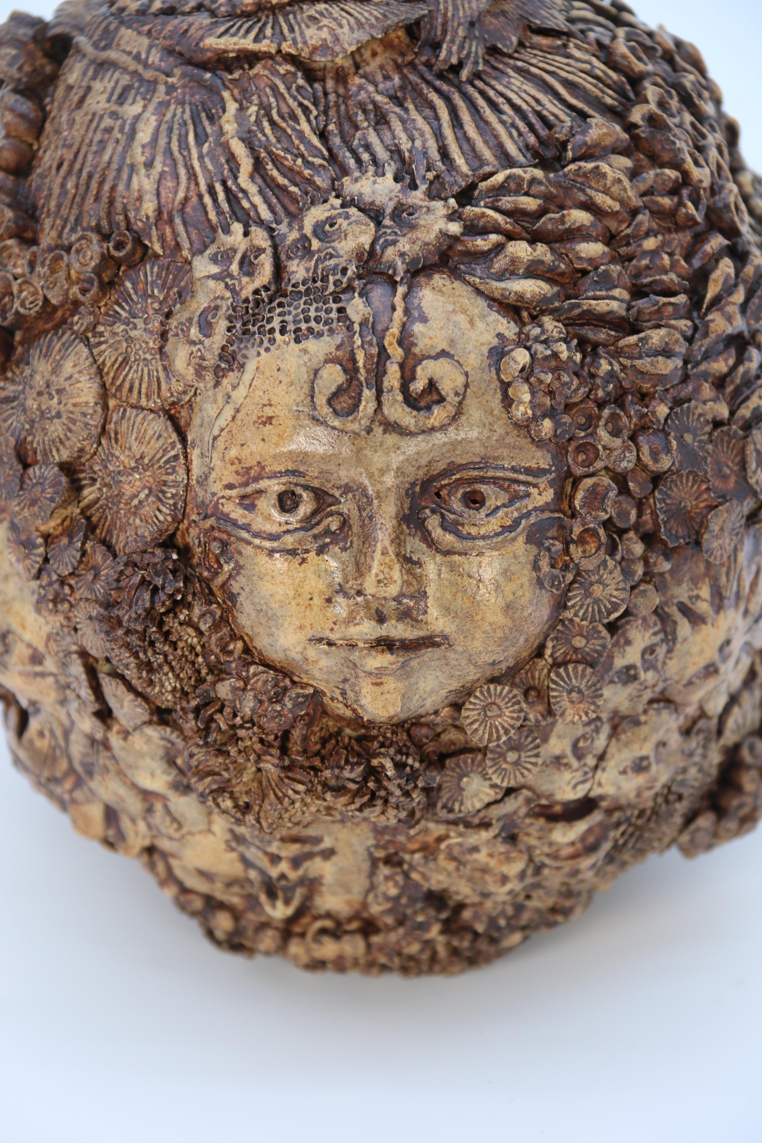 Studio pottery hand created mythical sculpture of the many faces of sea urchins 1