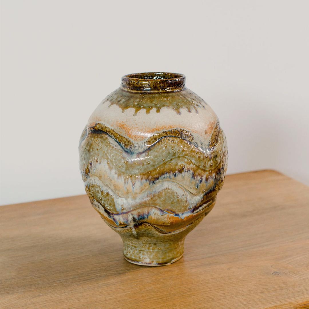 Large handmade vase with multi-colored dripping glaze. Studio pieces are handmade and may be functional or decorative but are unique in form, produced to be one-off and not for mass production