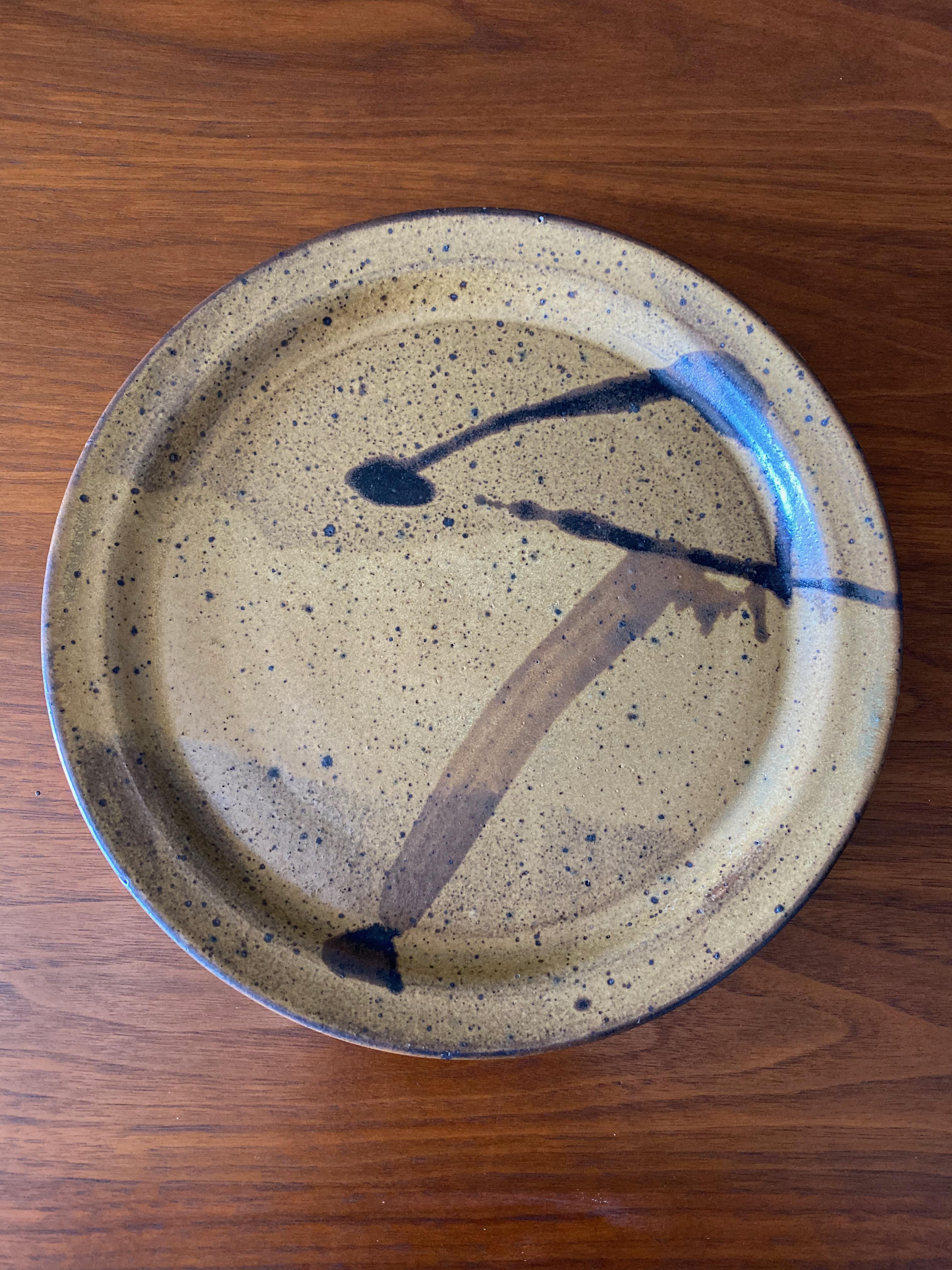Studio pottery signed charger / plate. Circa 1970.
