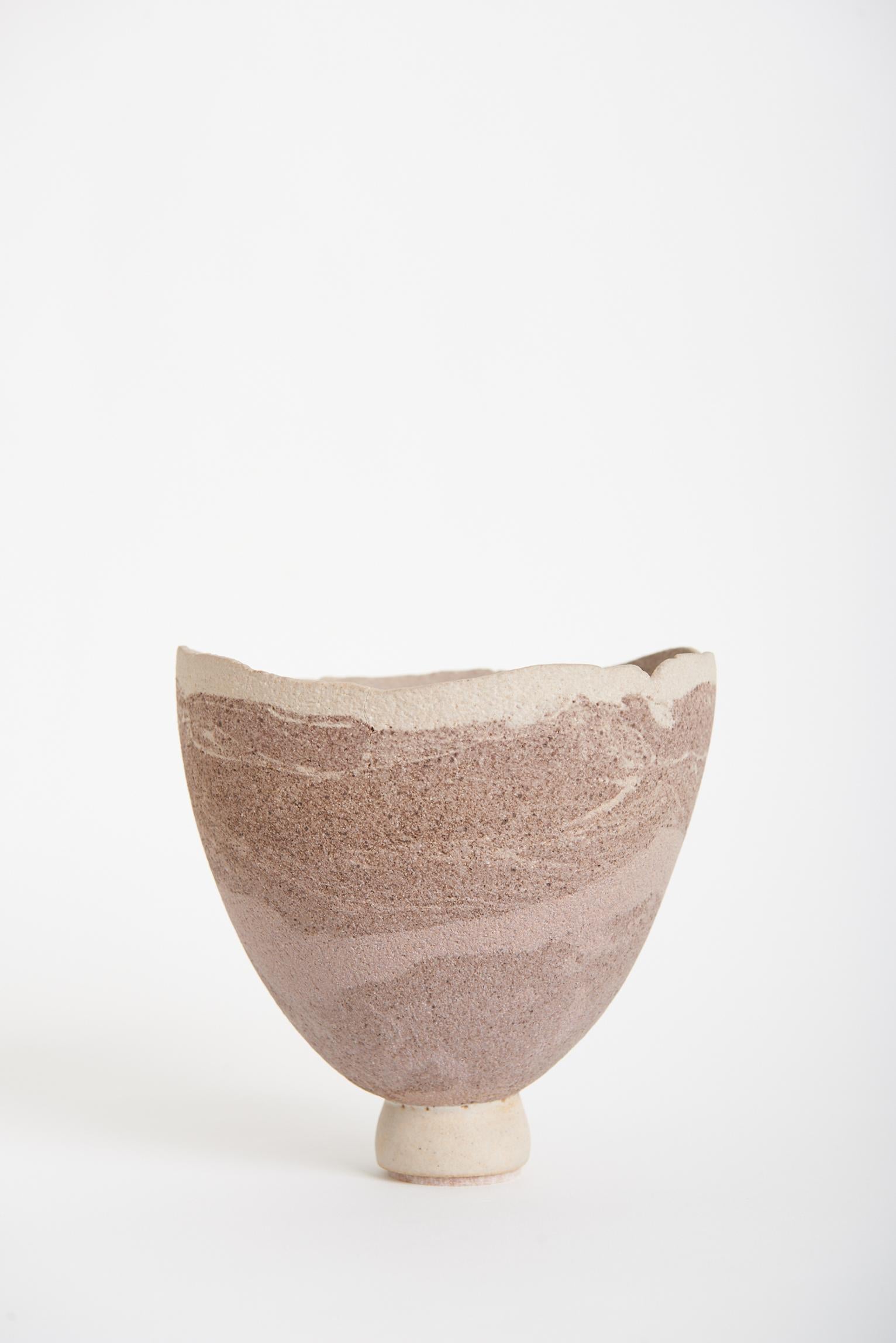 An unglazed studio ceramic vase.
England, 20th century.