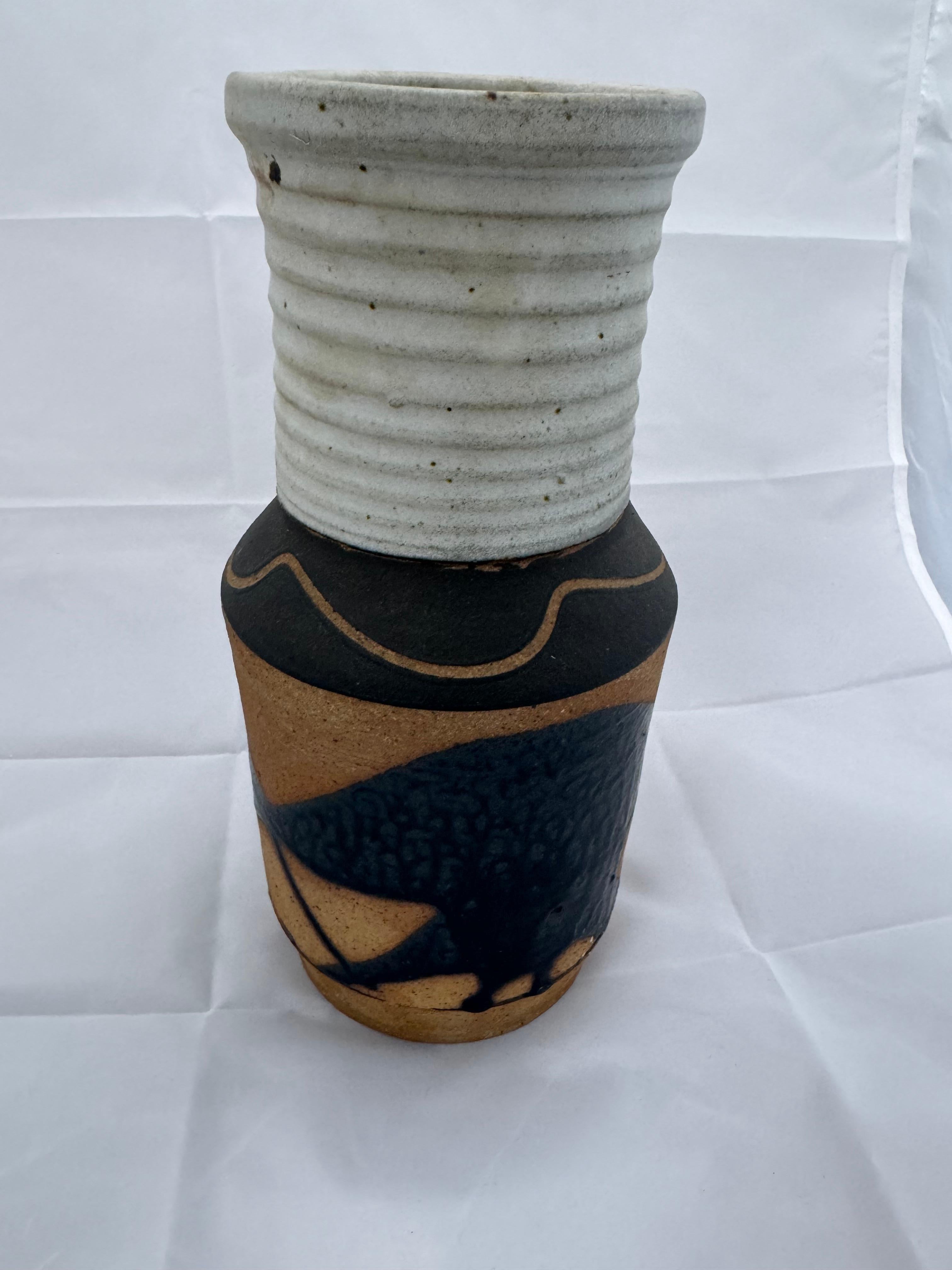 Nice Tall Pottery vase for your consideration