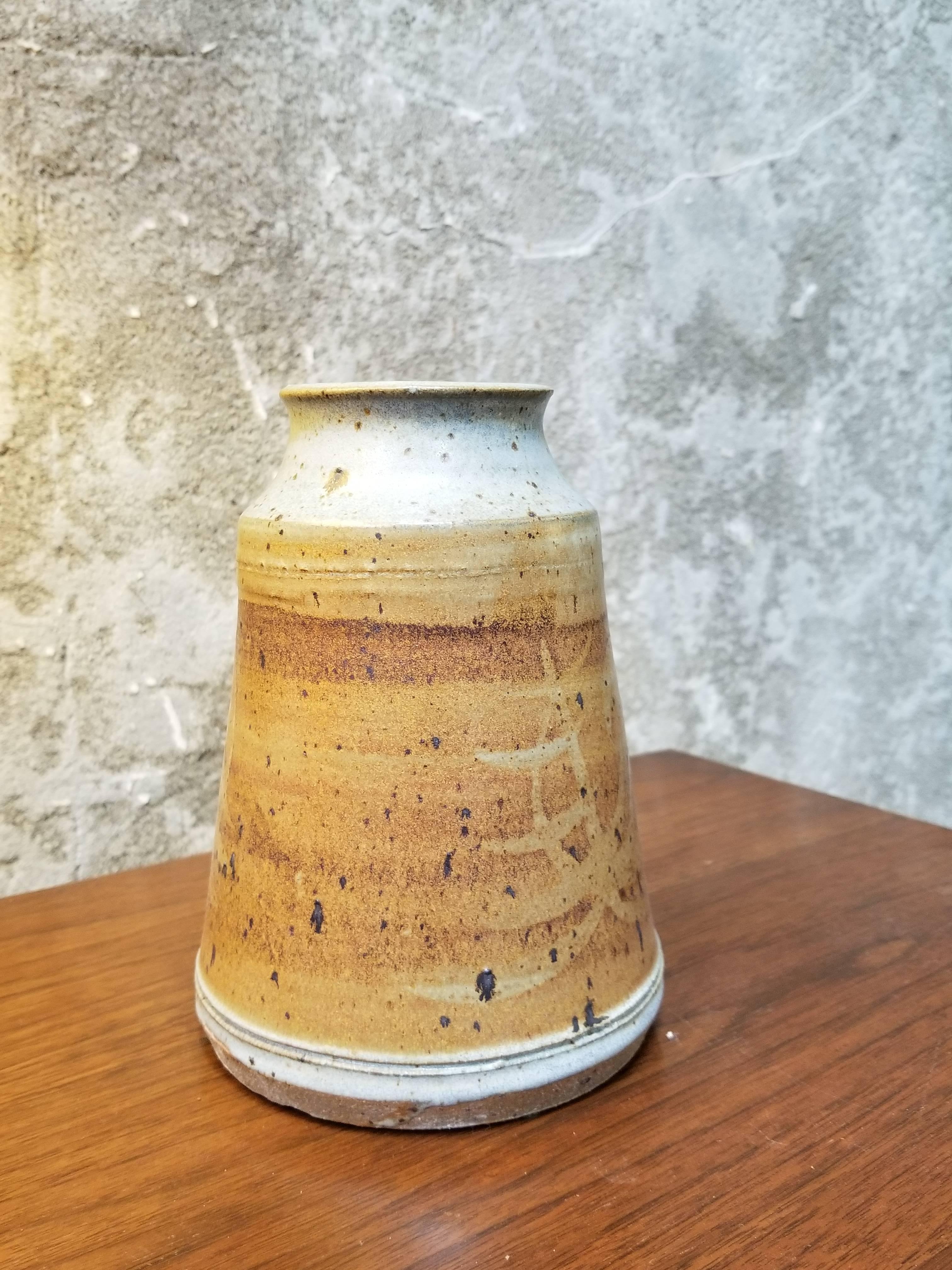 A pottery vase by San Francisco artist Herman Roderick Volz. Signed on base.
Painter, muralist, lithographer, set designer and ceramist. Formal training at the Art und Gewerbescule in Zurich and the Academy of Fine Arts, Vienna. Immigrated from