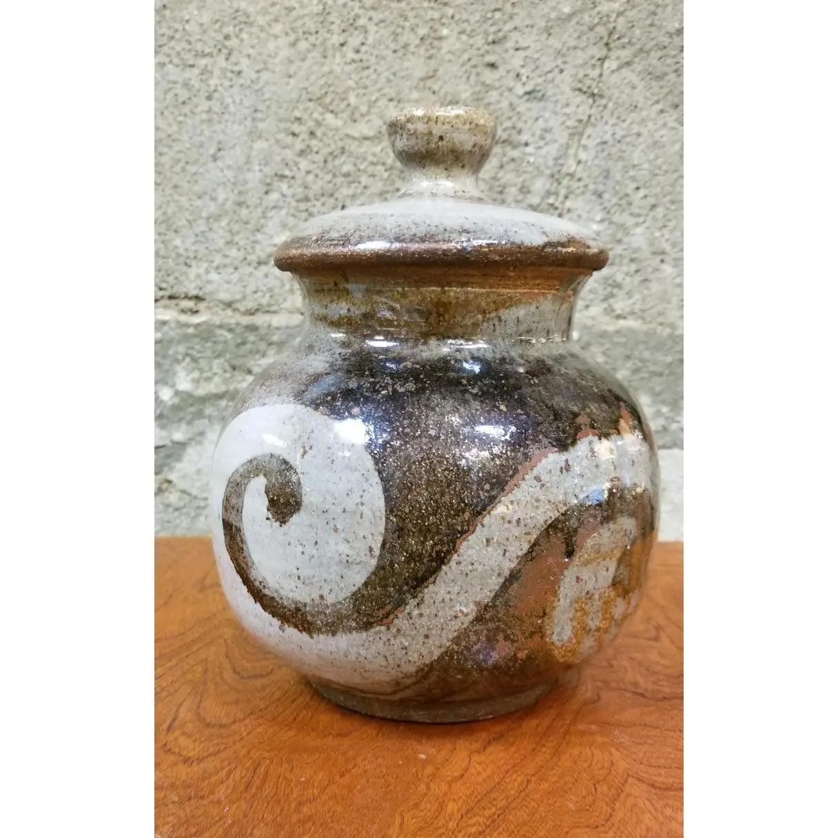 A Mid-Century Modern lidded pottery vase or jar by San Francisco artist Herman Roderick Volz, circa 1970s. Signed on base.
Painter, muralist, lithographer, set designer and ceramist. Formal training at the Art und Gewerbescule in Zurich and the