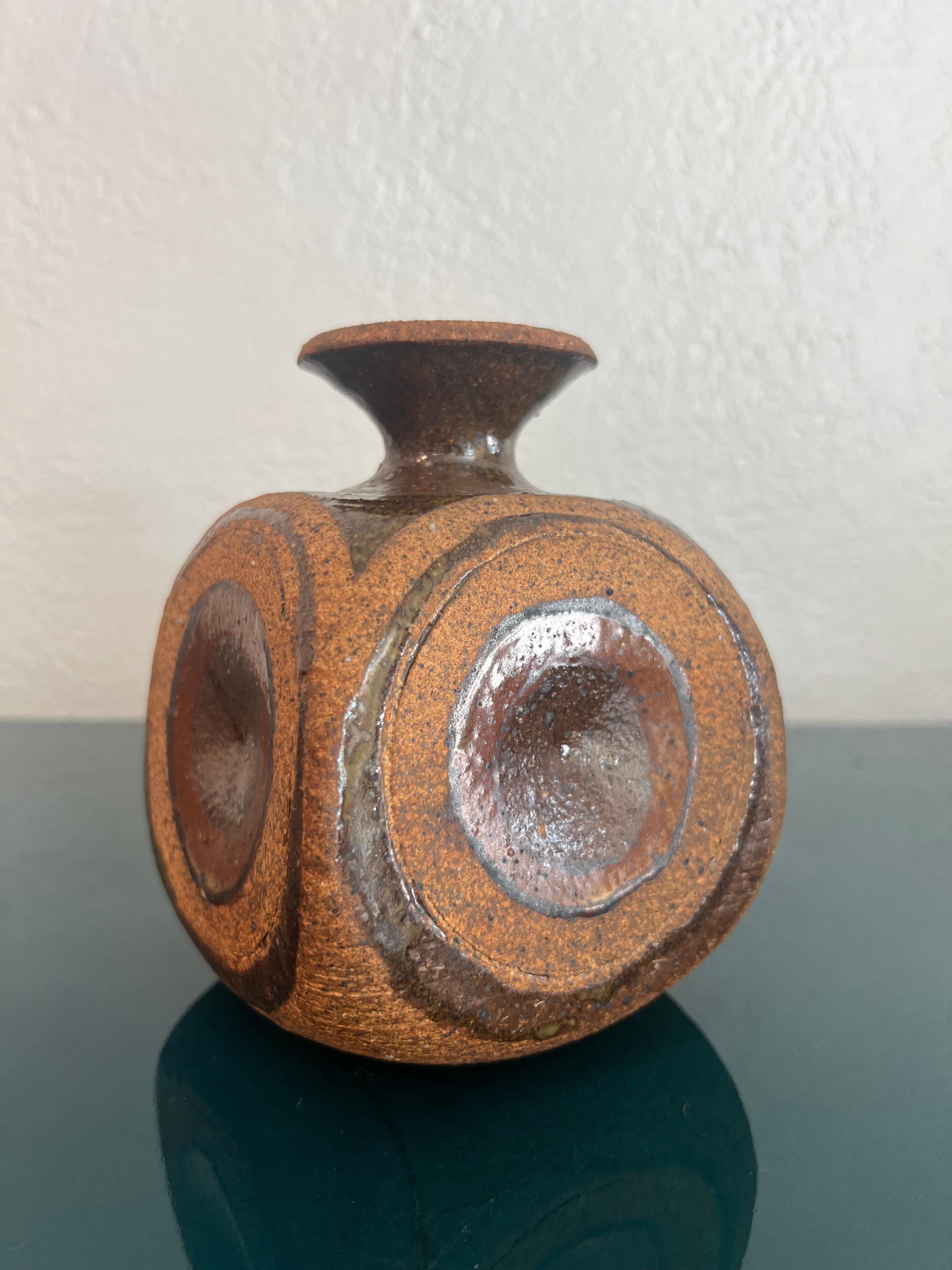 Signed studio pottery weed pot vase. 

Would work well in a variety of interiors such as modern, mid century modern, Hollywood regency, etc. Piece blends seamlessly with other designers such as Warren Platner, Paul Evans, Gabriella Crespi, Edward