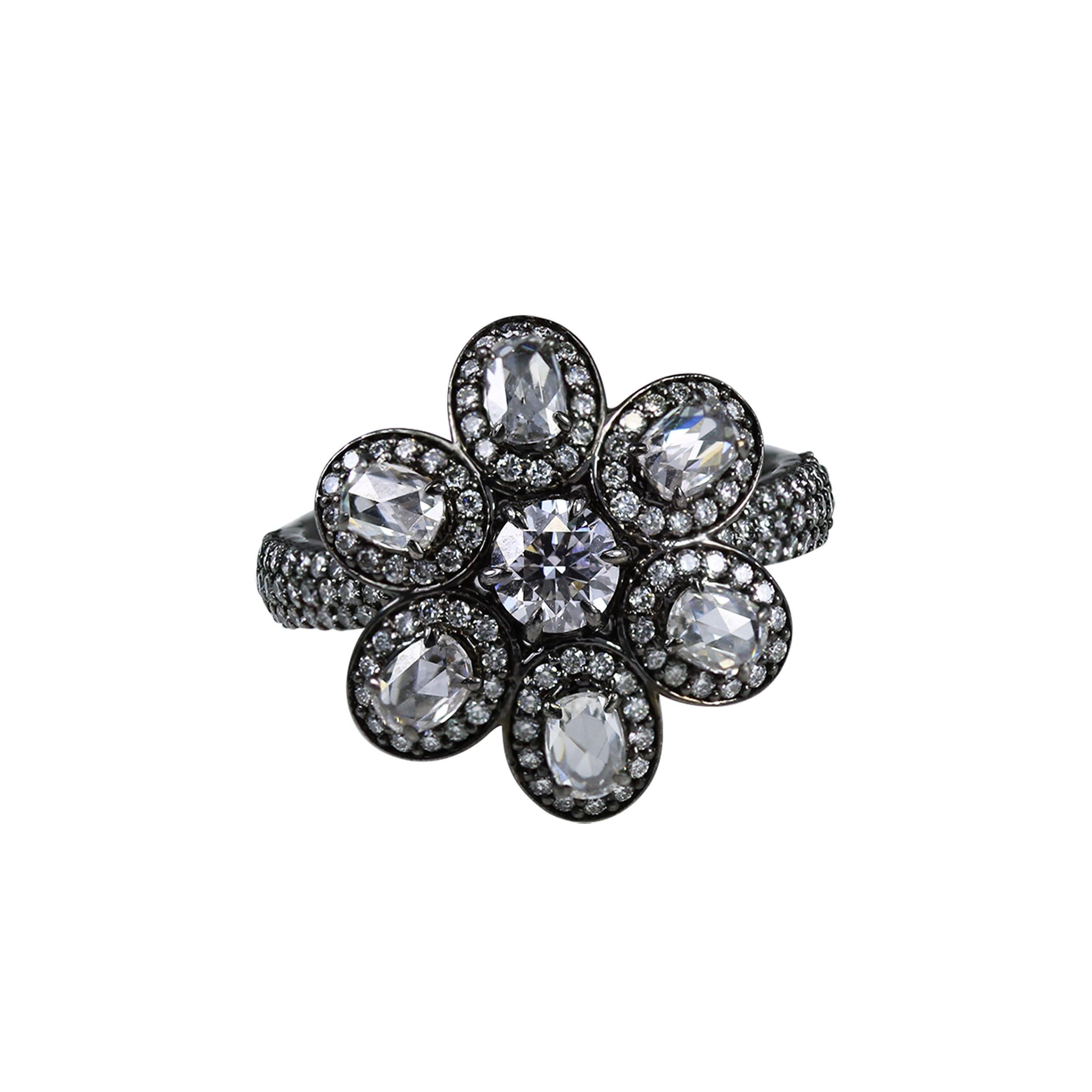 Diamond floral motif ring

Indulge yourself with this ultra-luxe 18K white gold ring in a floral motif, adorned with oval rose cut and round brilliant cut diamonds set in a delicate prong setting. Studded with 147 stones, this ring will easily form