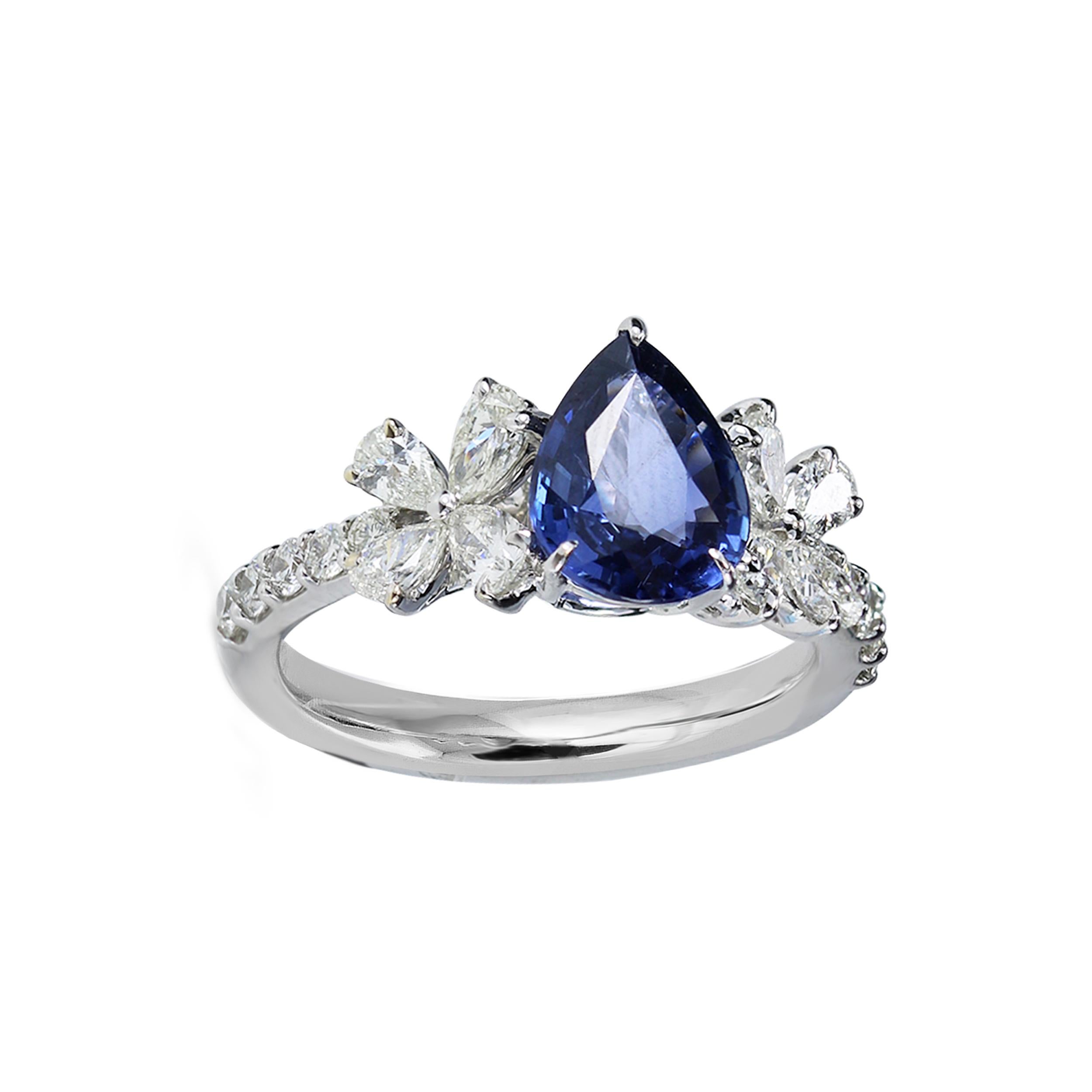 Diamond and blue sapphire ring

This floral inspired diamond and blue sapphire ring promises to sparkle eternally. The blooms that flank the majestic sapphire are composed of pear and round brilliant cut diamonds in a classic prong setting, set in