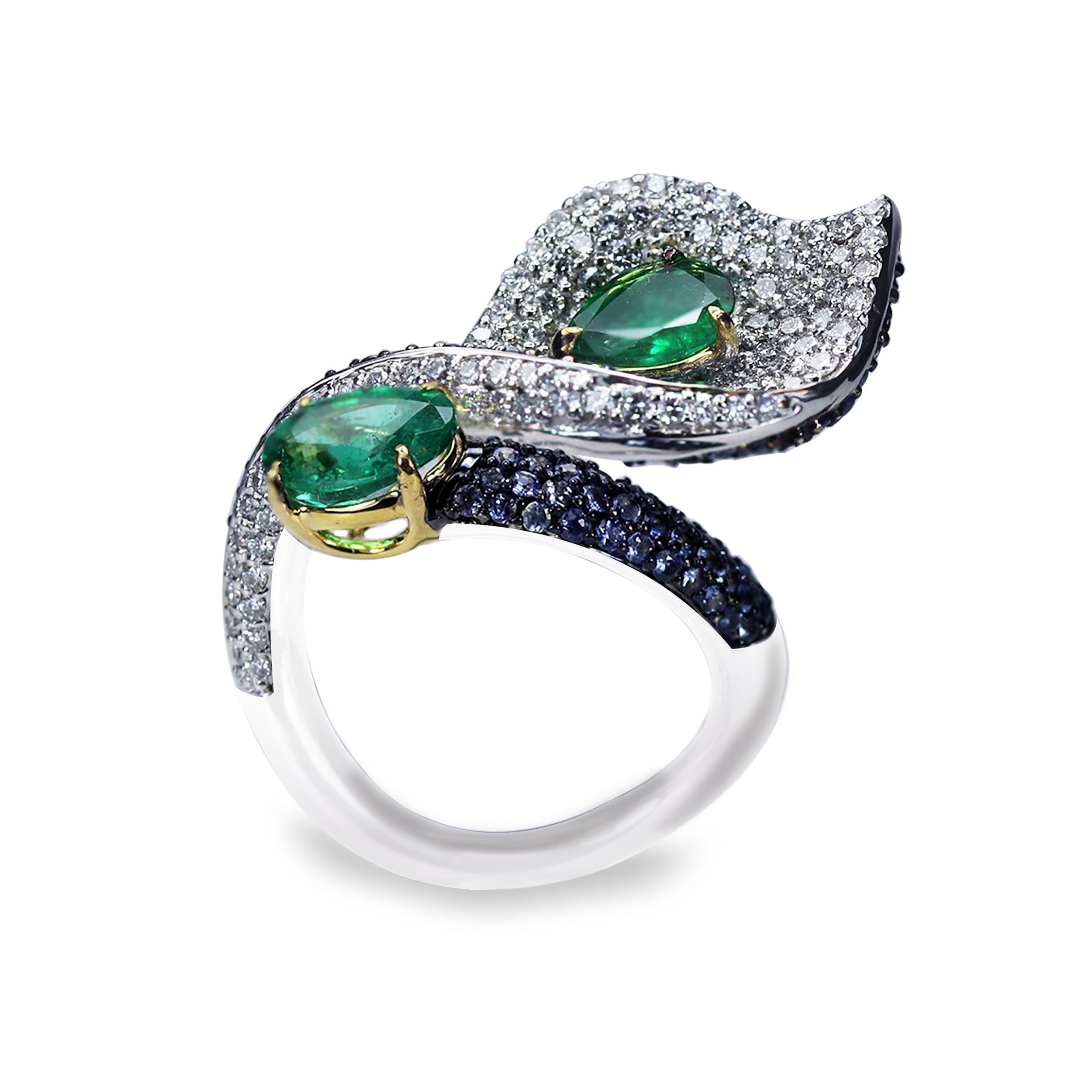 F-G/ SI diamonds, emeralds and blue sapphire ring 

This show-stopping cocktail ring is made even more stand out with the playful swirls of stones that seamlessly flow into the next. The epitome of fluidity meets form, this cocktail ring is crafted