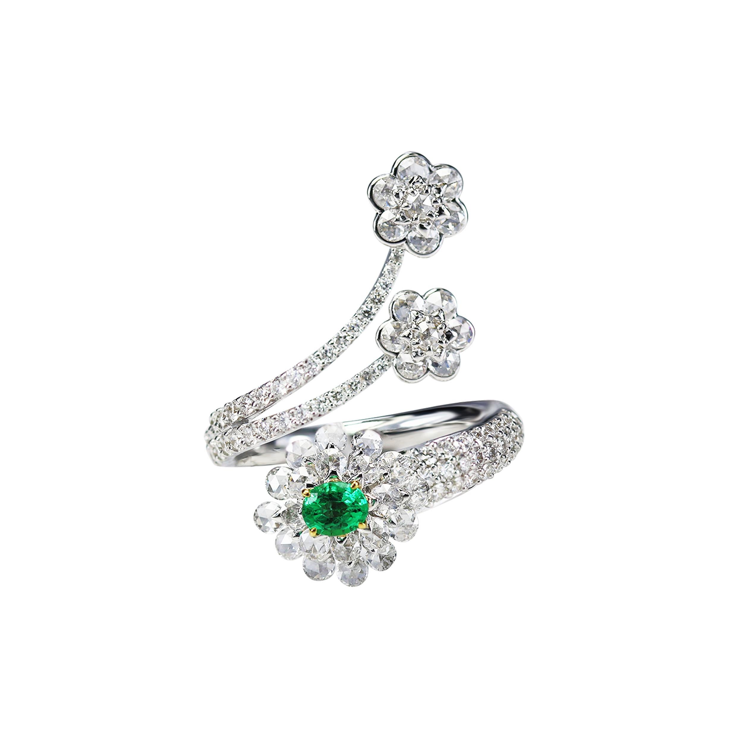 Diamond and emerald ring

Give your repertoire a show-stopping allure with this exquisitely sculpted floral cocktail ring crafted using 18K white and yellow gold set with rose cut round and round brilliant cut diamonds, and emeralds in a drill and