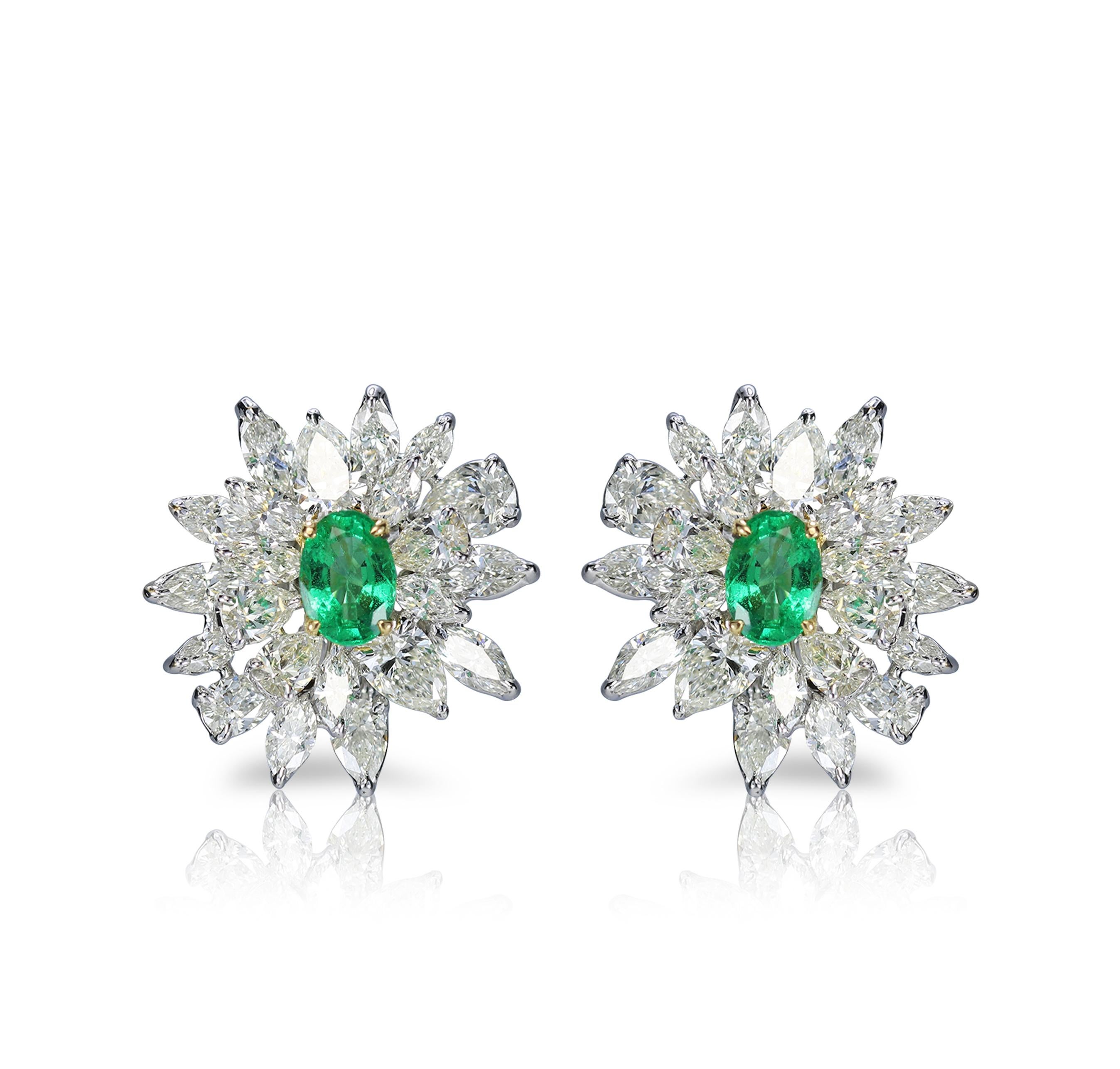 Diamond and Emerald Earrings

Emeralds have the distinct power of making everything they touch abundantly luxurious, and this pair of 18K white and yellow gold floral-shaped earrings studded with brilliant cut marquise and pear diamonds and emeralds