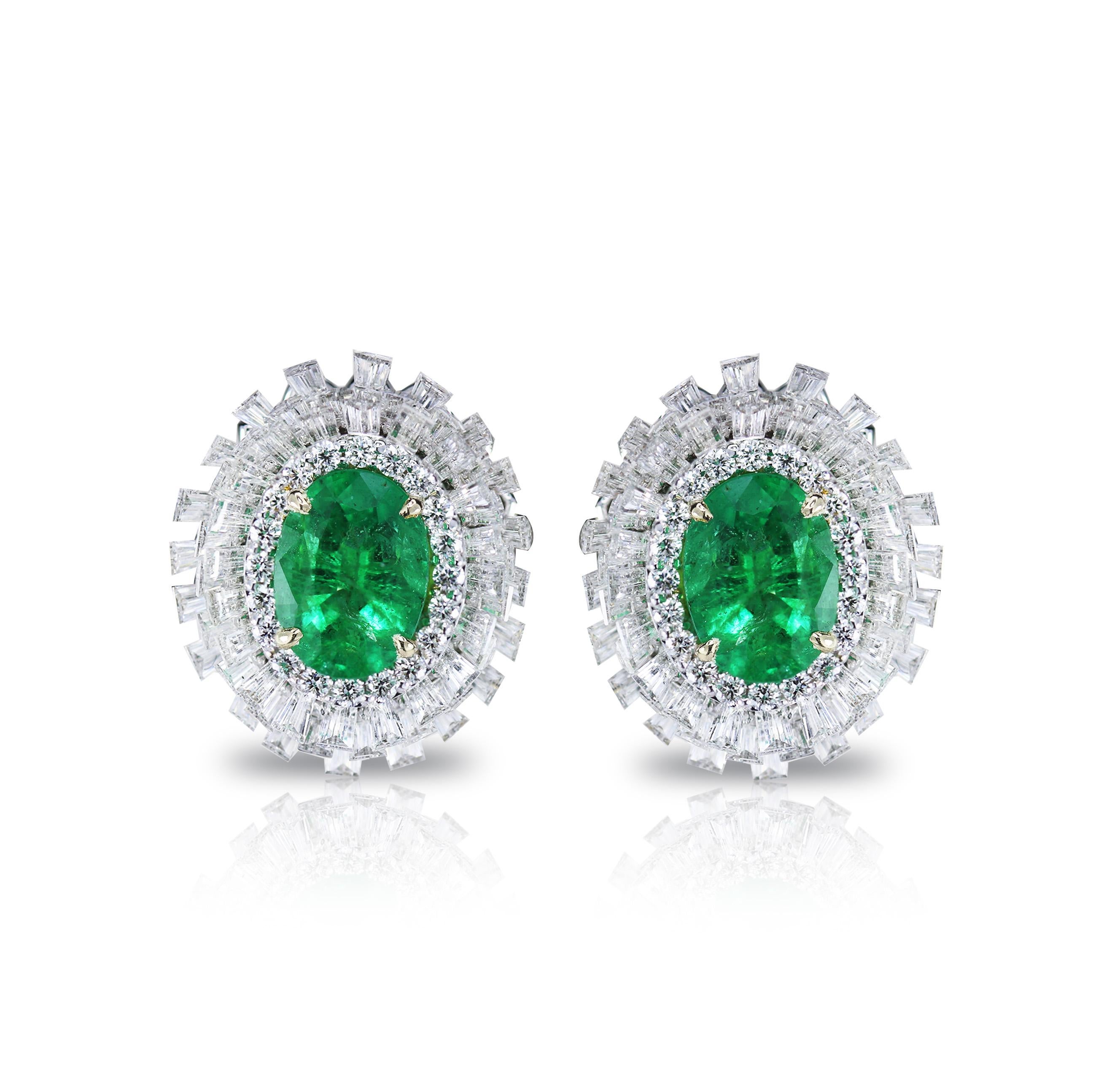 Diamond and Emerald Stud Earrings

A piece of jewellery that brightens up a room with its sparkle is worth owning. This 18K white gold stud earrings studded generously with round and baguettes brilliant cut diamonds and a showstopping emerald is a