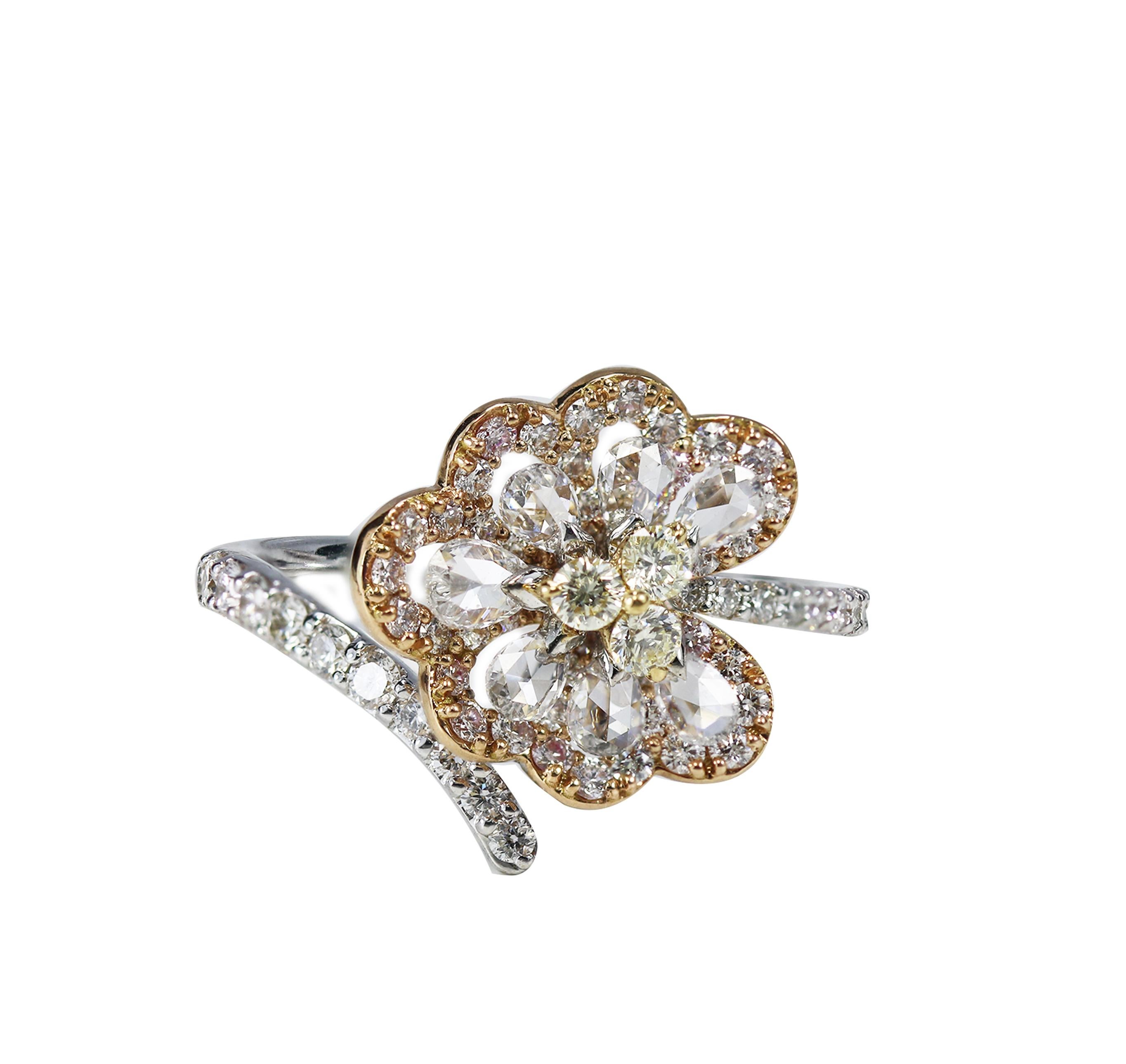 White and yellow diamond ring

A unique design results in this captivating 18K white, yellow and rose gold ring featuring pear rosecut and round brilliant cut white and yellow diamonds delicately set in a drill and prong setting. Statement-making