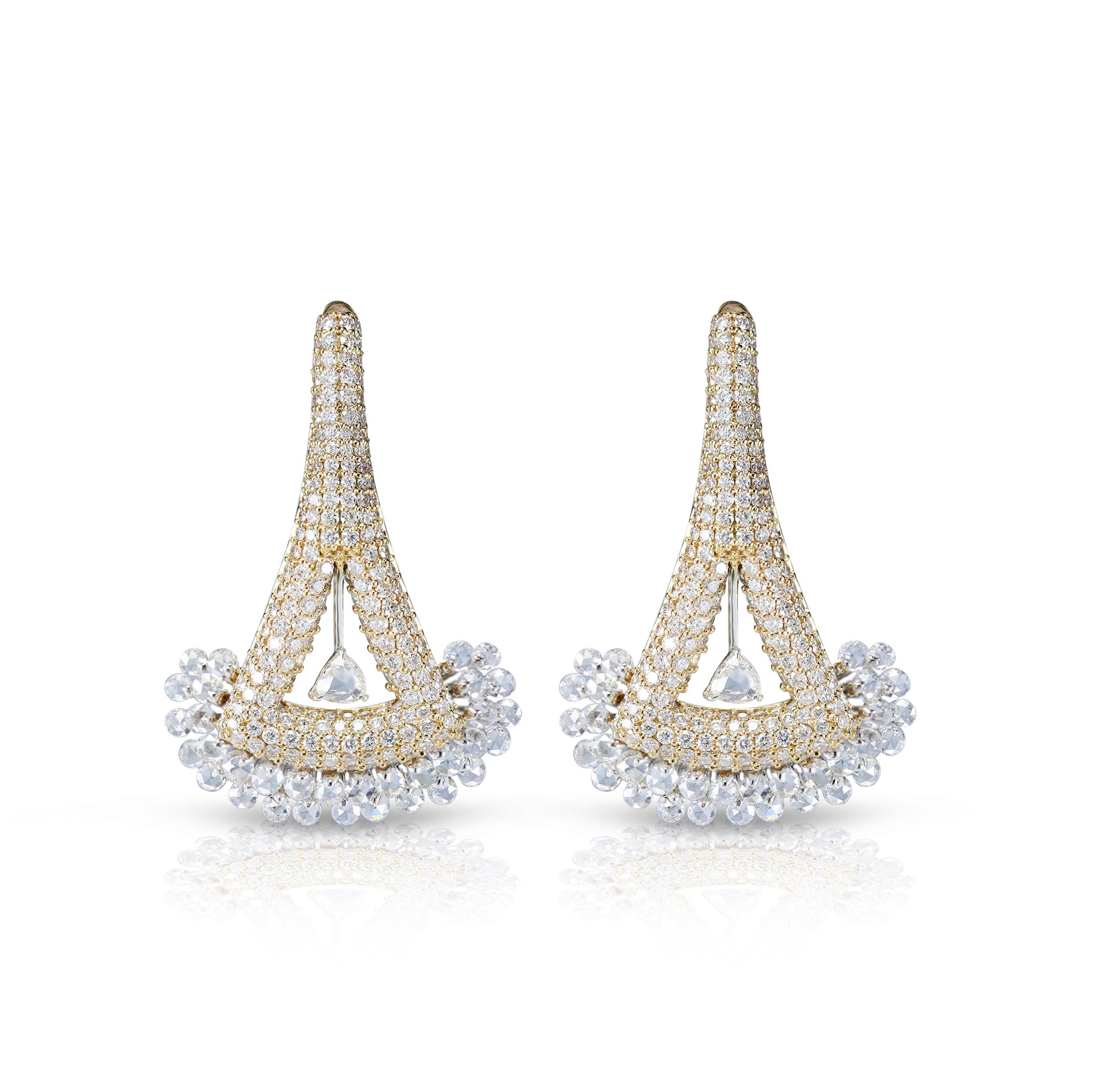 Trillion and Round Rose cut and Round Brilliant cut Earrings

A decidedly modern shape is carved with rounds and trillion rosecut and round brilliant cut diamonds set in 18K white and rose gold with a pave and drill setting creating a timeless pair