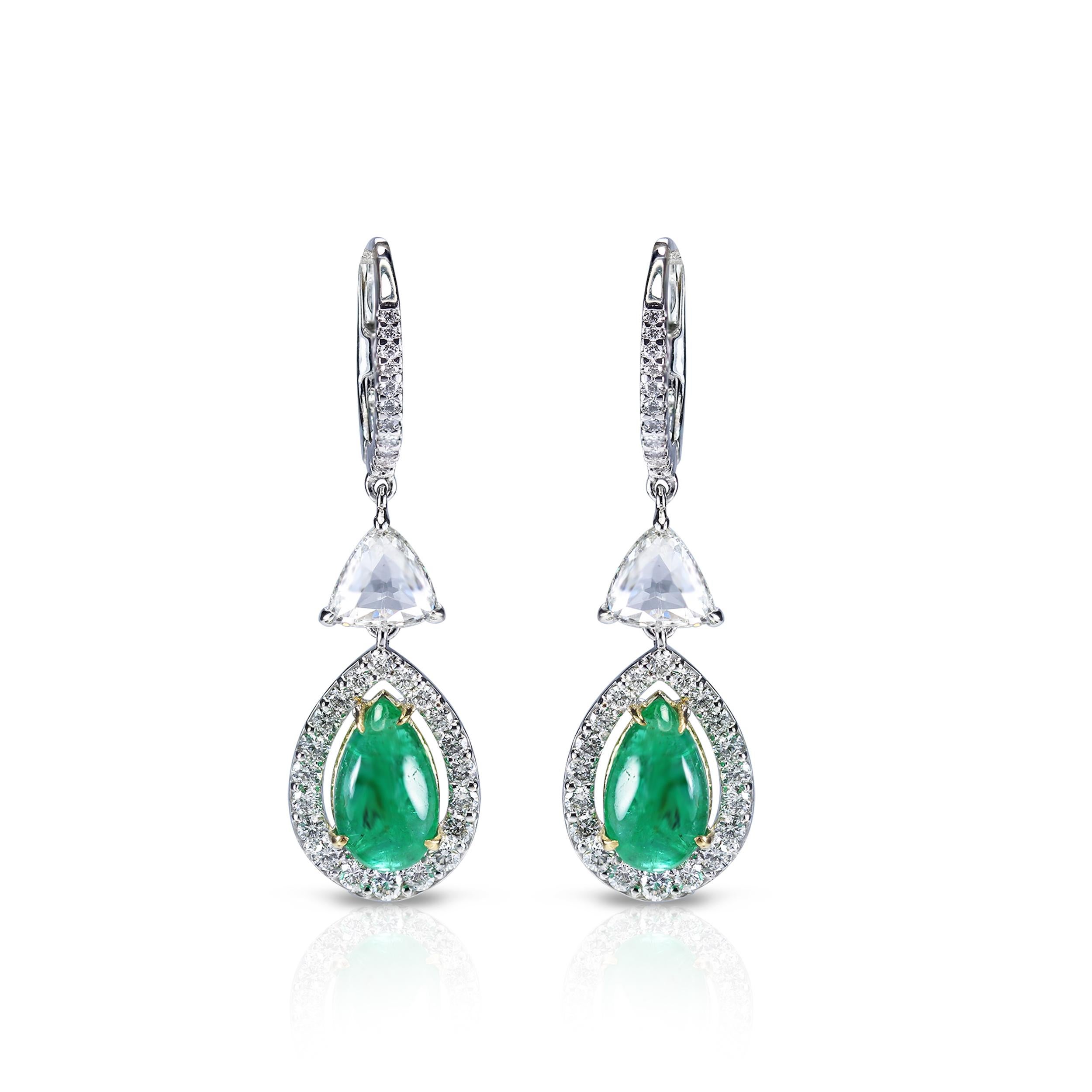 Diamond and emerald earrings

Keeping it simple never looked as elegant as this pair of 18K white gold drop earrings adorned with rose cut trillion and round brilliant cut diamonds and emeralds in a prong and pave setting. Unique in design, it's