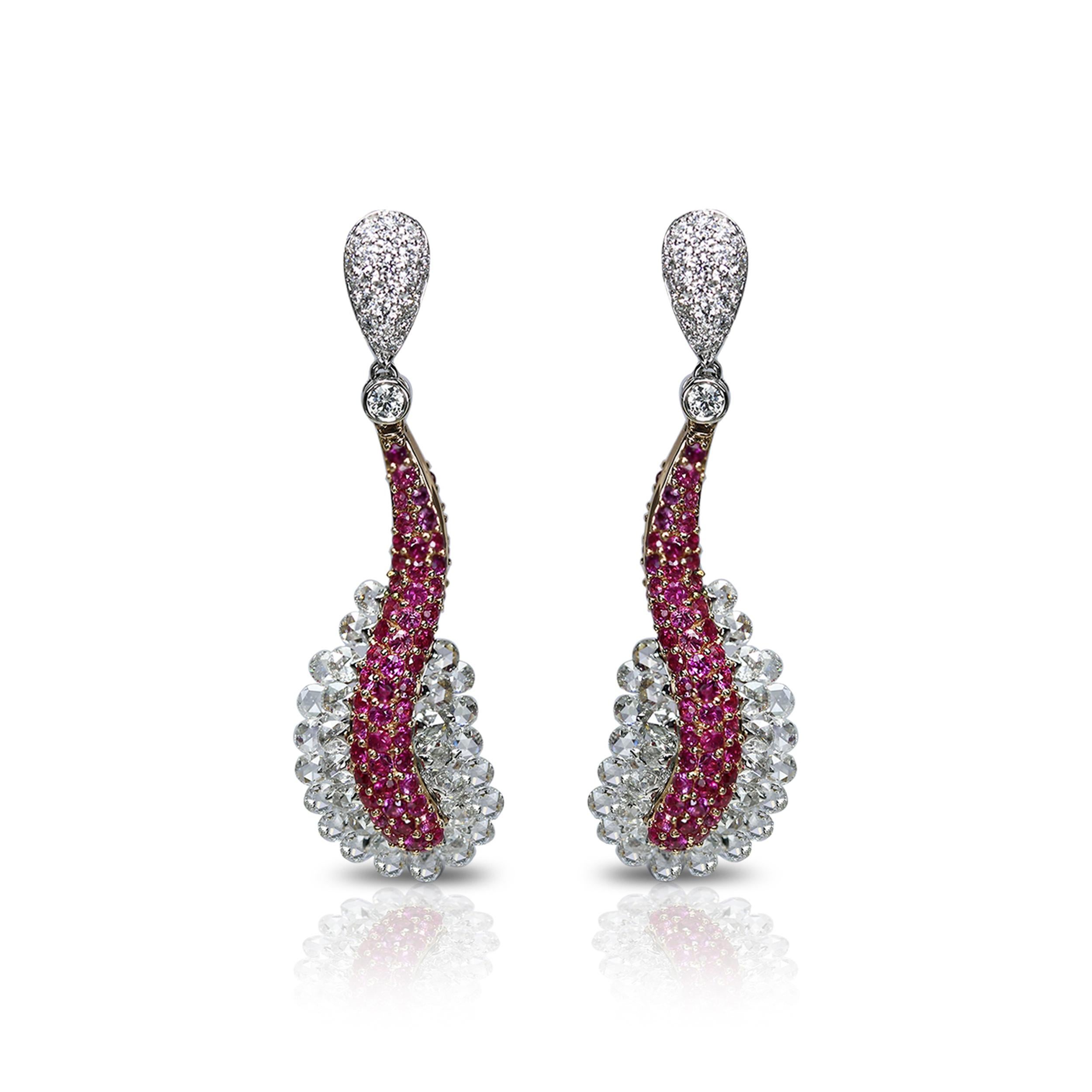 Pink sapphire and diamond earrings

These 18K white and rose gold earrings adorned with round rosecut and round brilliant cut diamonds and pink sapphires make just the right kind of memorable statement. Adorned with 330 stones set in an exquisite