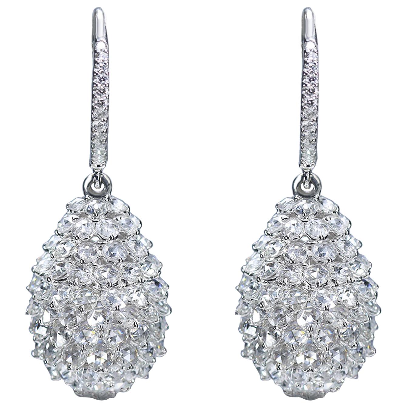 F-G/ VS-SI brilliant cut and rosecut diamond earrings

These diamond drop earrings are a rare combination of modern design and delicate sensibility. Created using an 18K white gold and studded with 246 F-G color VS-SI brilliant and rosecut diamonds