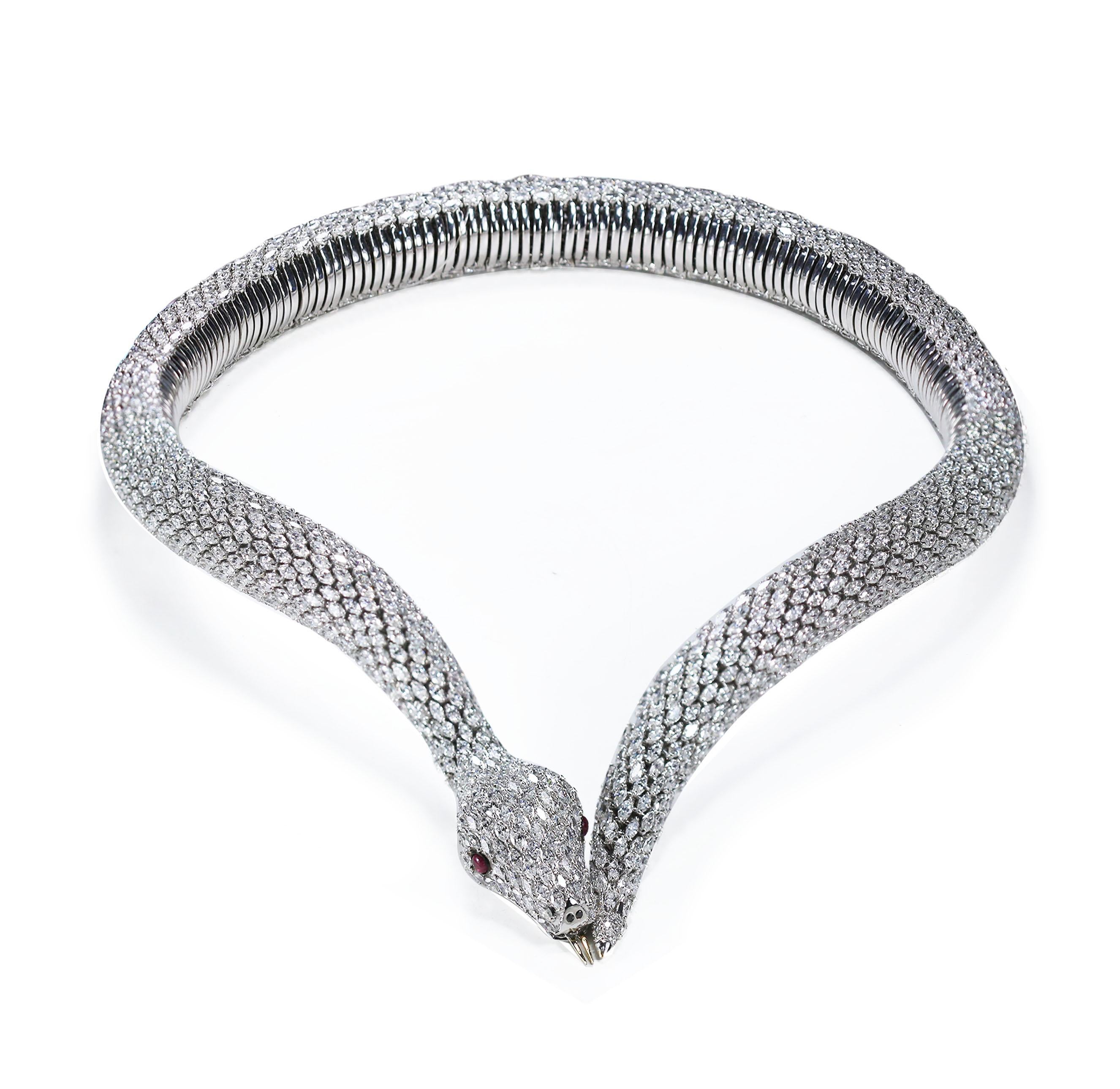 Diamonds, Black diamonds and Ruby Snake Spring necklace

Our serpentine-inspired collar necklace recreates the luxuriousness of snakeskin with this diamond, black diamond and ruby necklace in a prong setting, on a base of 18K white gold. Prepare to