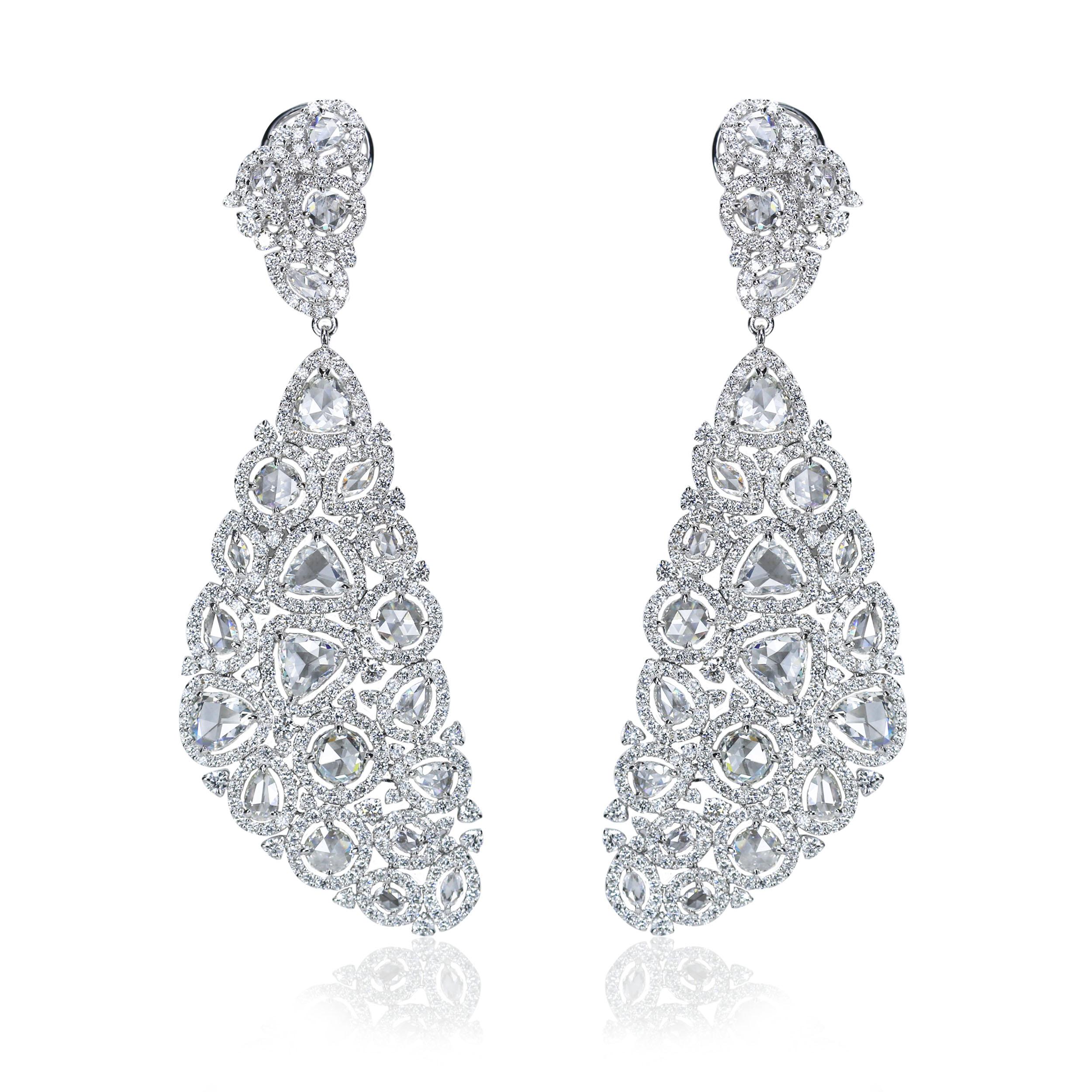 F-G/ VS-SI Brilliant cut and Rosecut Diamond Earrings 

Celebrating the time-honoured allure of diamonds is this pair of 18K white gold earrings that is generously studded with 720 brilliant cut and rosecut diamonds of varying sizes. Its real