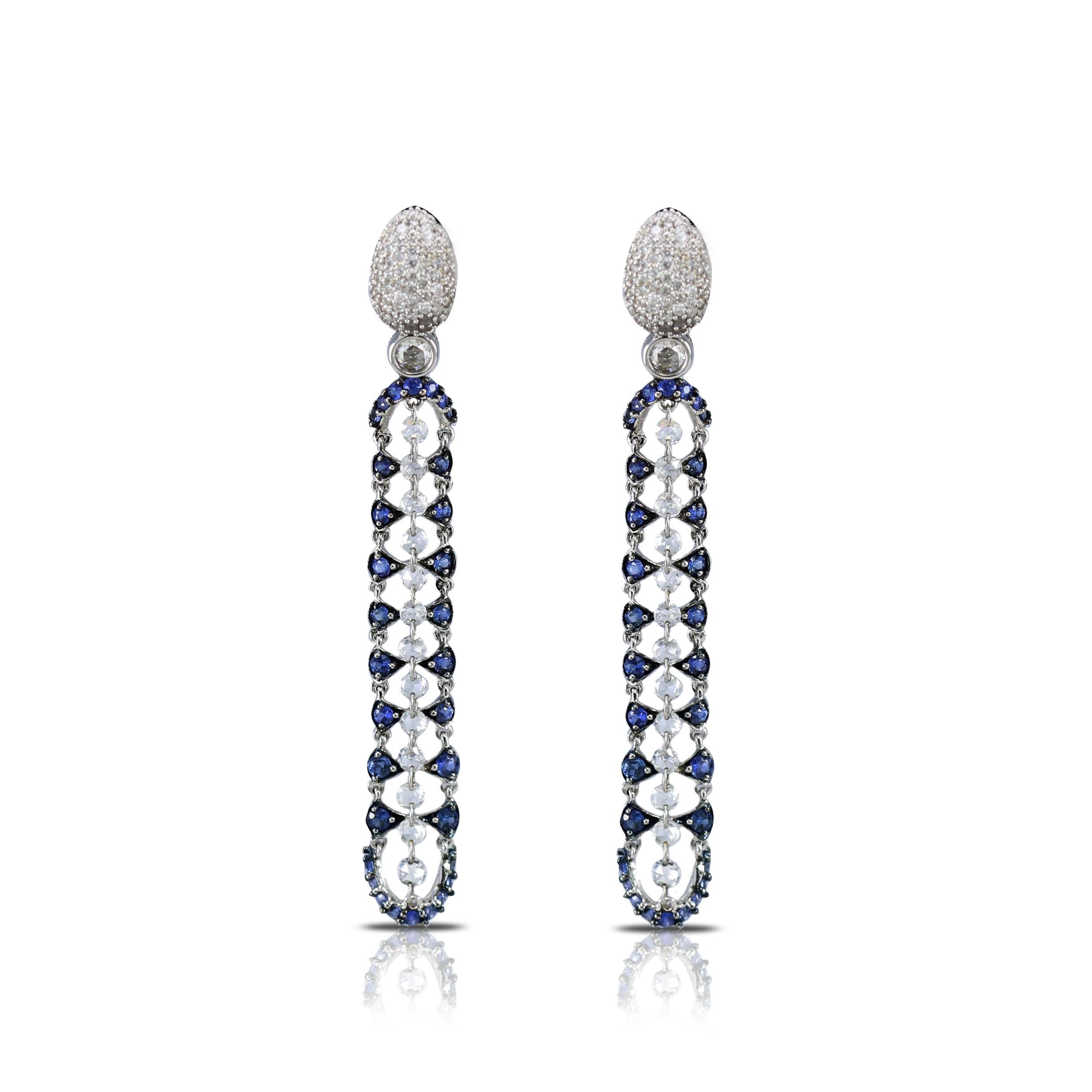 Diamond and blue sapphire danglers

Capture the essence and mystery of a dark night with this pair of 18K white gold earrings exquisitely adorned with round rose cut and brilliant cut diamonds and blue sapphires in a drill, pave and prong setting.