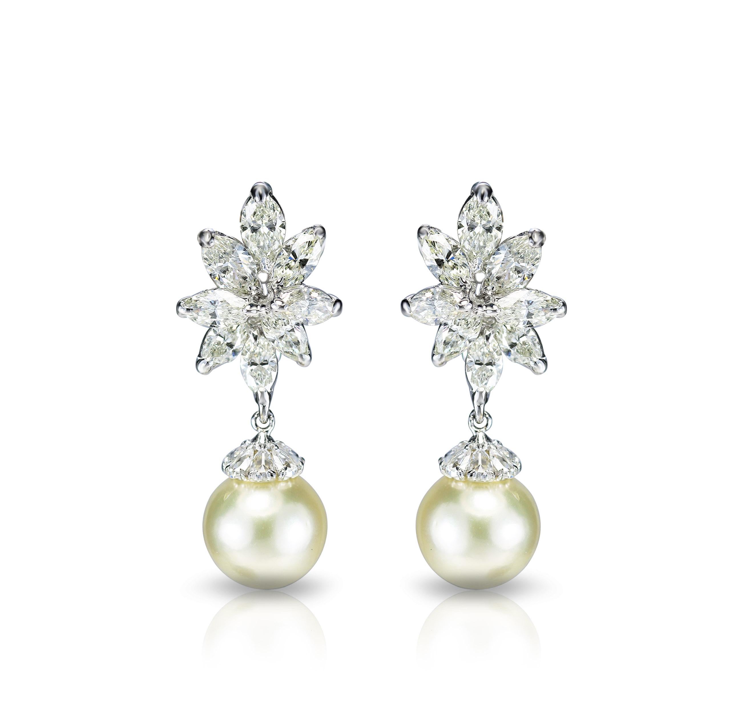 Diamond and south sea pearl earrings

Delicate flowers with calming pearl drops make up this beautiful pair of 18K white gold earrings that are carefully studded with brilliant cut marquise, pear rose cut diamonds and south sea pearls in a prong