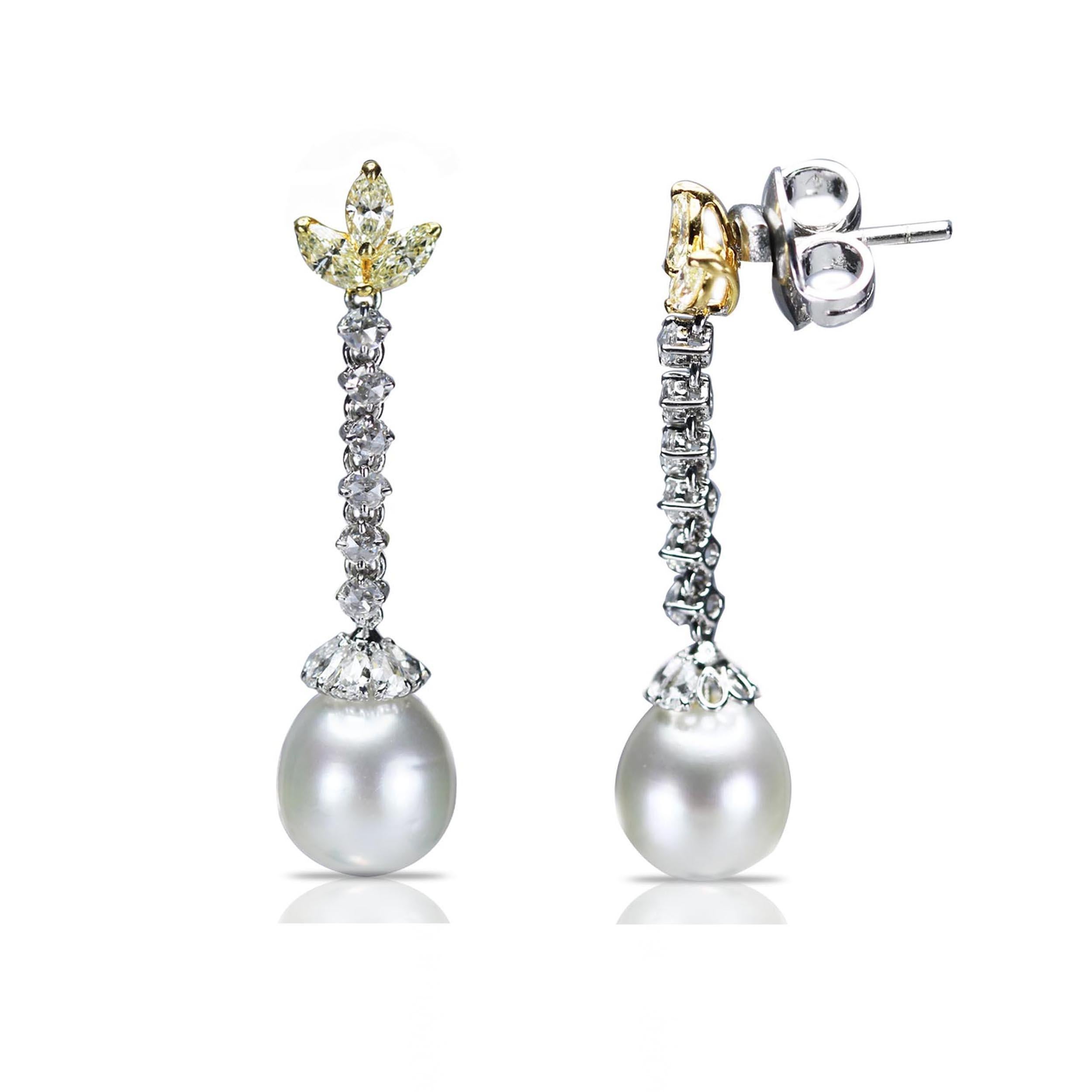 F-G/ VS-SI brilliant cut white diamonds and yellow diamonds, rosecut diamonds and south sea pearl earrings

Delicate and dainty, these earrings are the epitome of elegance. The dangling pair includes an 18K white and yellow gold base studded with F-