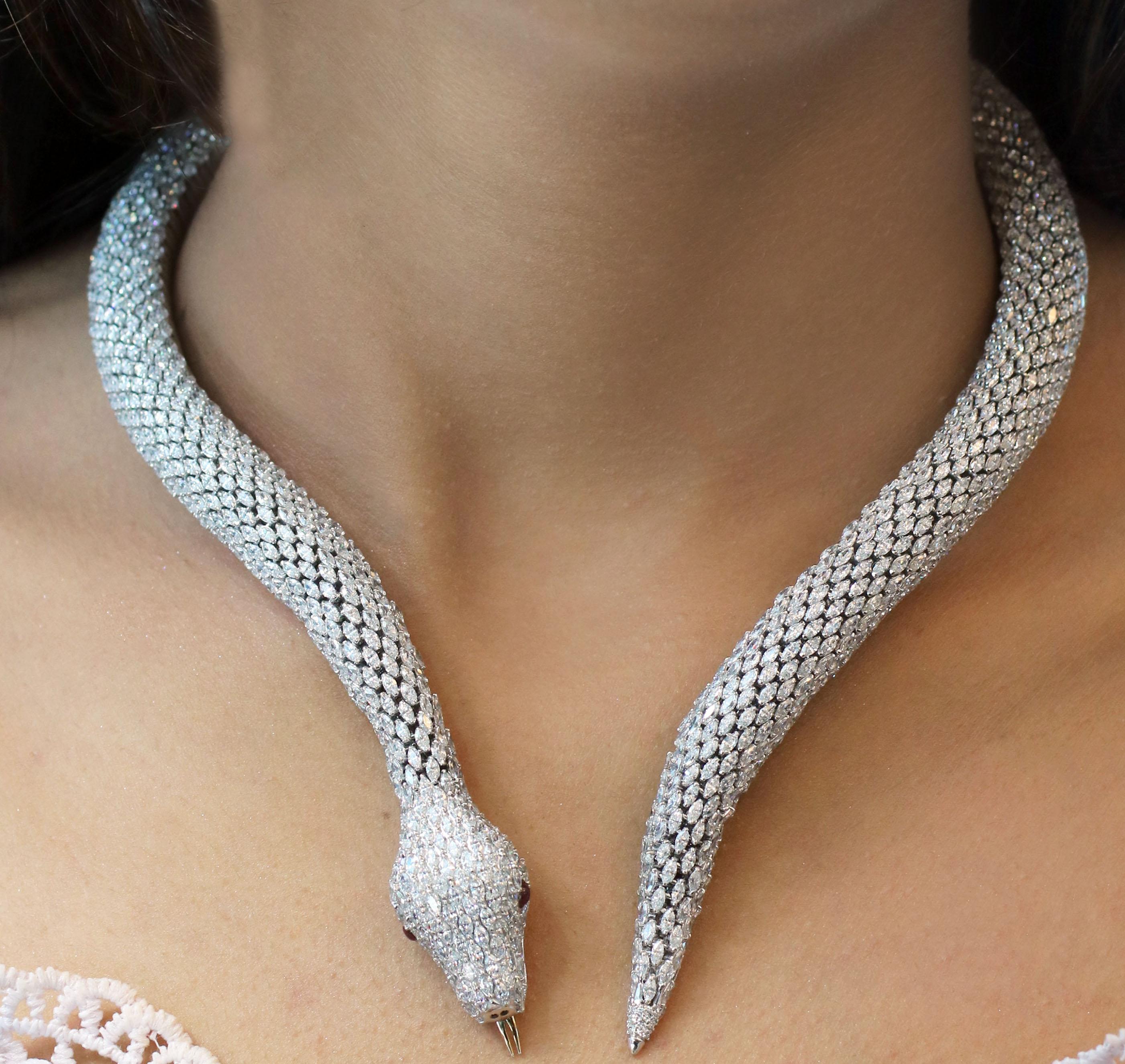 Gross Weight: 223.58 Grams
Diamond Weight: 68.84 cts
Colour Stone Weight: 0.27 cts
Neck Size: 13.5 inches
IGI Certified: Summary No: 25J155401808

Video of the product can be shared on request.

Our serpentine-inspired collar necklace recreates the