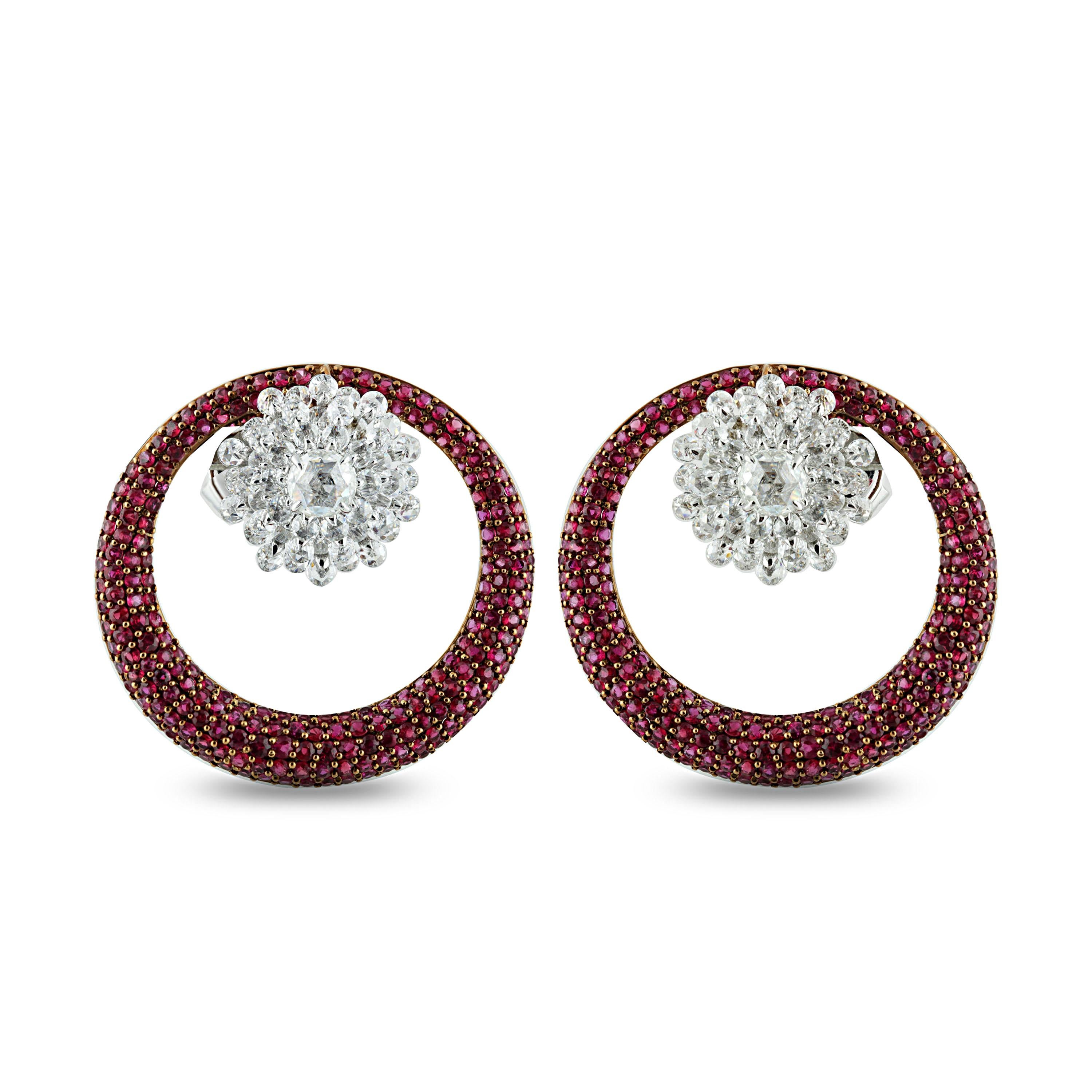 Red and diamond earrings

Brilliant and beautiful, these 18K white and yellow gold earrings studded with rubies and round rose cut diamonds in prong, pave and drill settings will cast a memorable spell. The standout design makes it a collectible, a