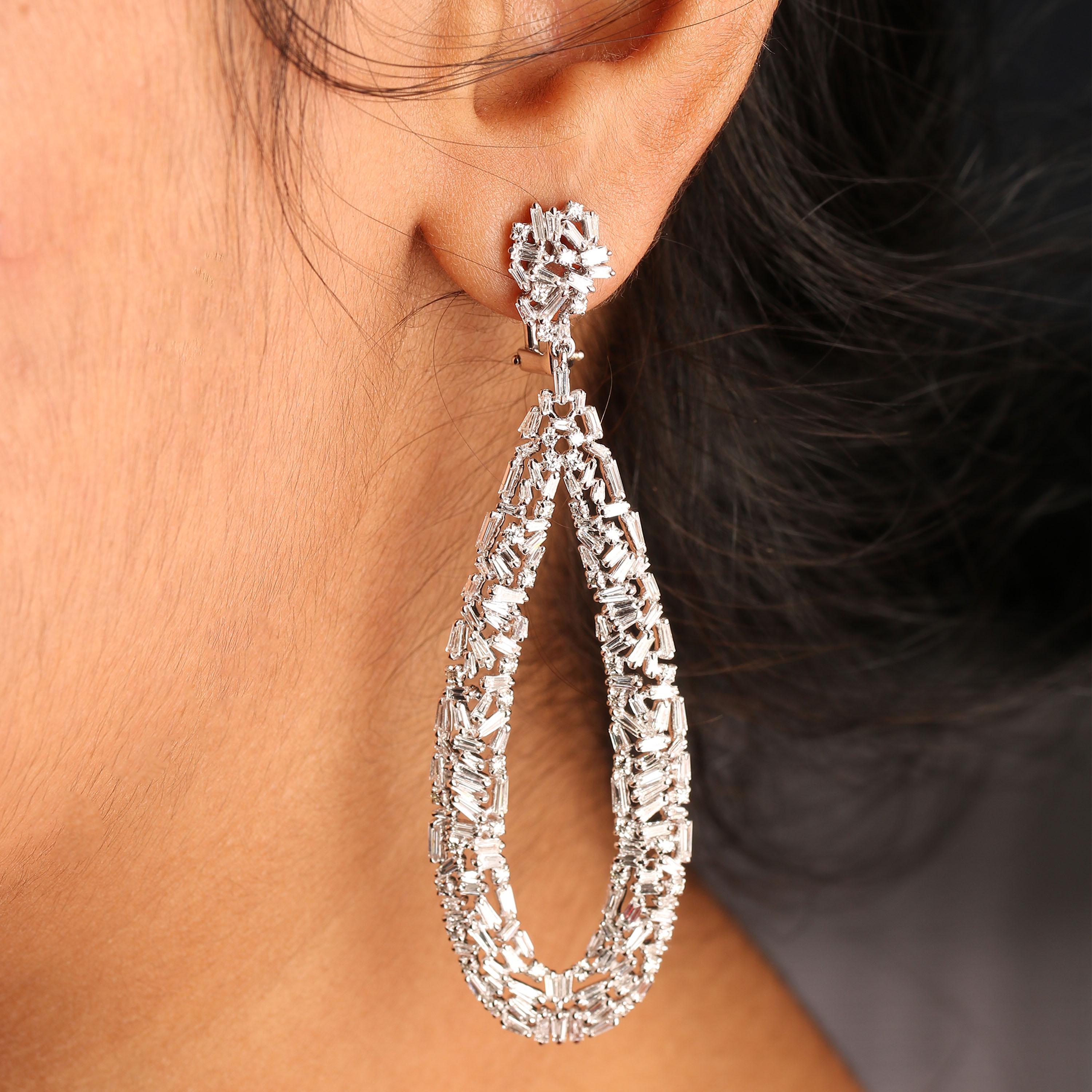 Gross Weight: 18.90 Grams
Diamond Weight: 5.22 cts
Currently No Graded. IGI Certification can be done on request

Video can be uploaded on request.

Inspired by geometrical art, carefully crafted these intricate designed dangling earrings in 18