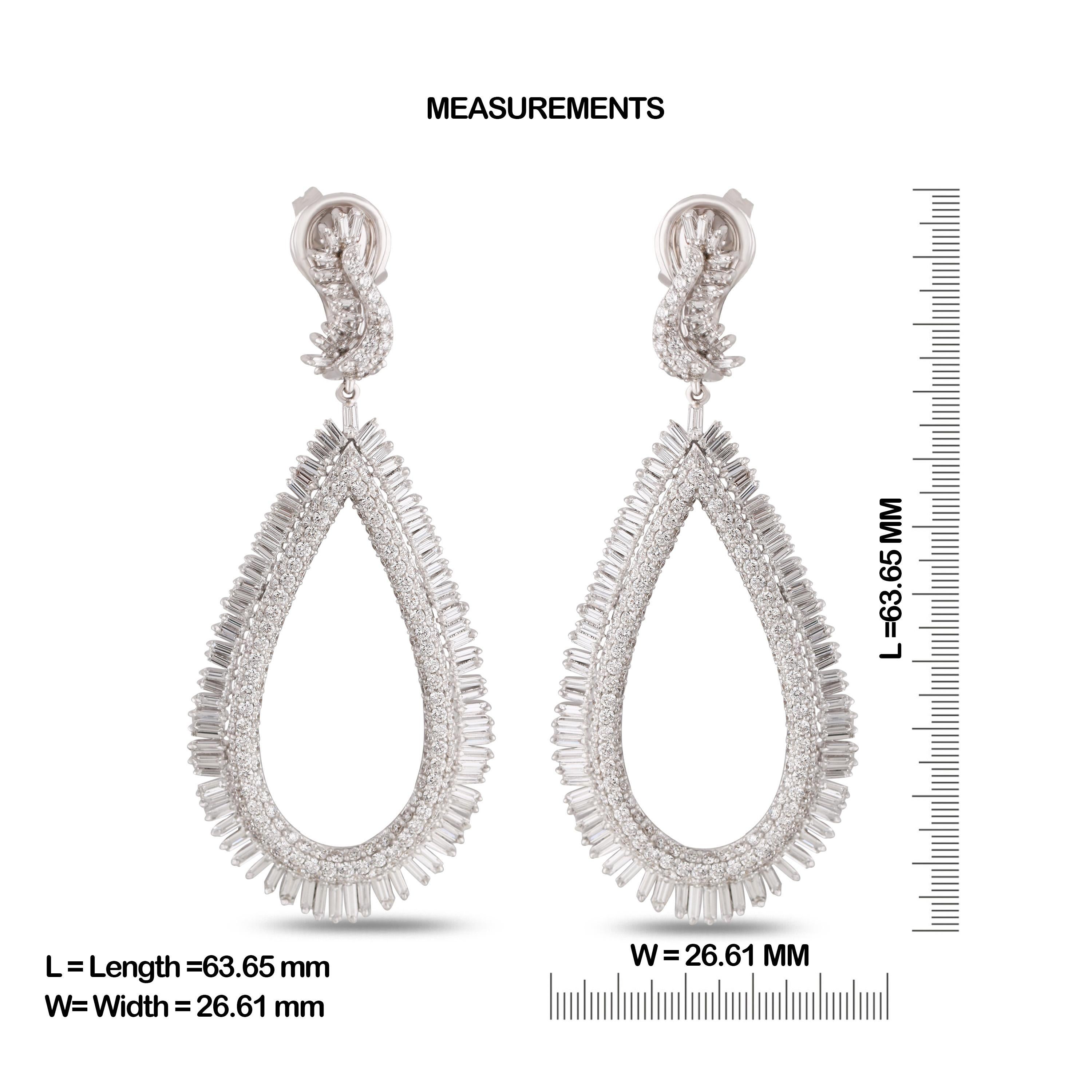 Gross Weight: 24.67 Grams
Diamond Weight: 6.40 cts
IGI Certification can be done on request.

Video can be uploaded on request.

Shine bright with these elegant big danglers, studded with baguettes and round brilliant cut diamonds in 18 karat gold.