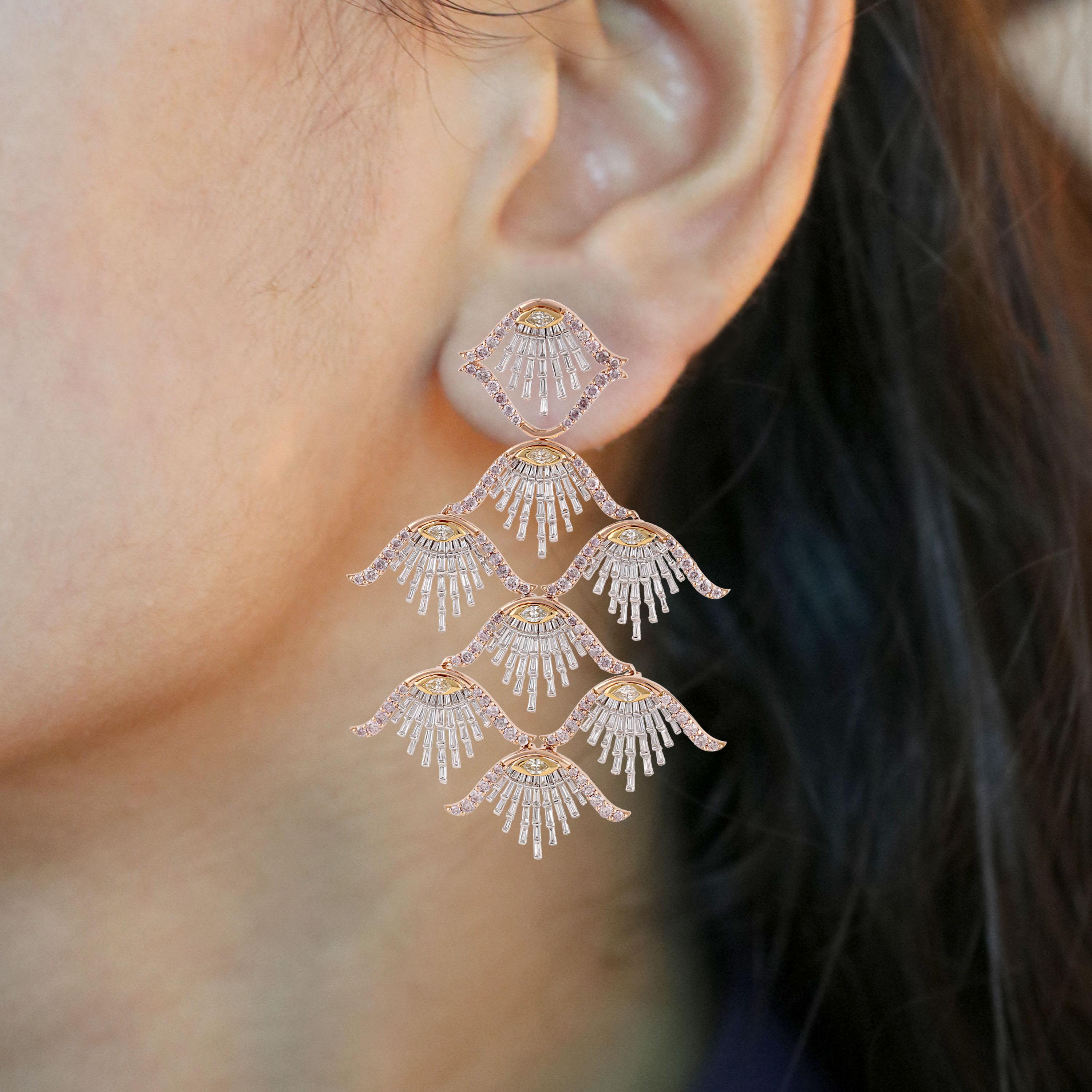 Gross Weight: 47.66 Grams
Diamond Weight: 11.60 cts
IGI Certification can be done on request.

Video of the product  can be shared on request.

These dangling earrings are reminiscent of a sea shell. Fabricated in 18 karat white, yellow and rose