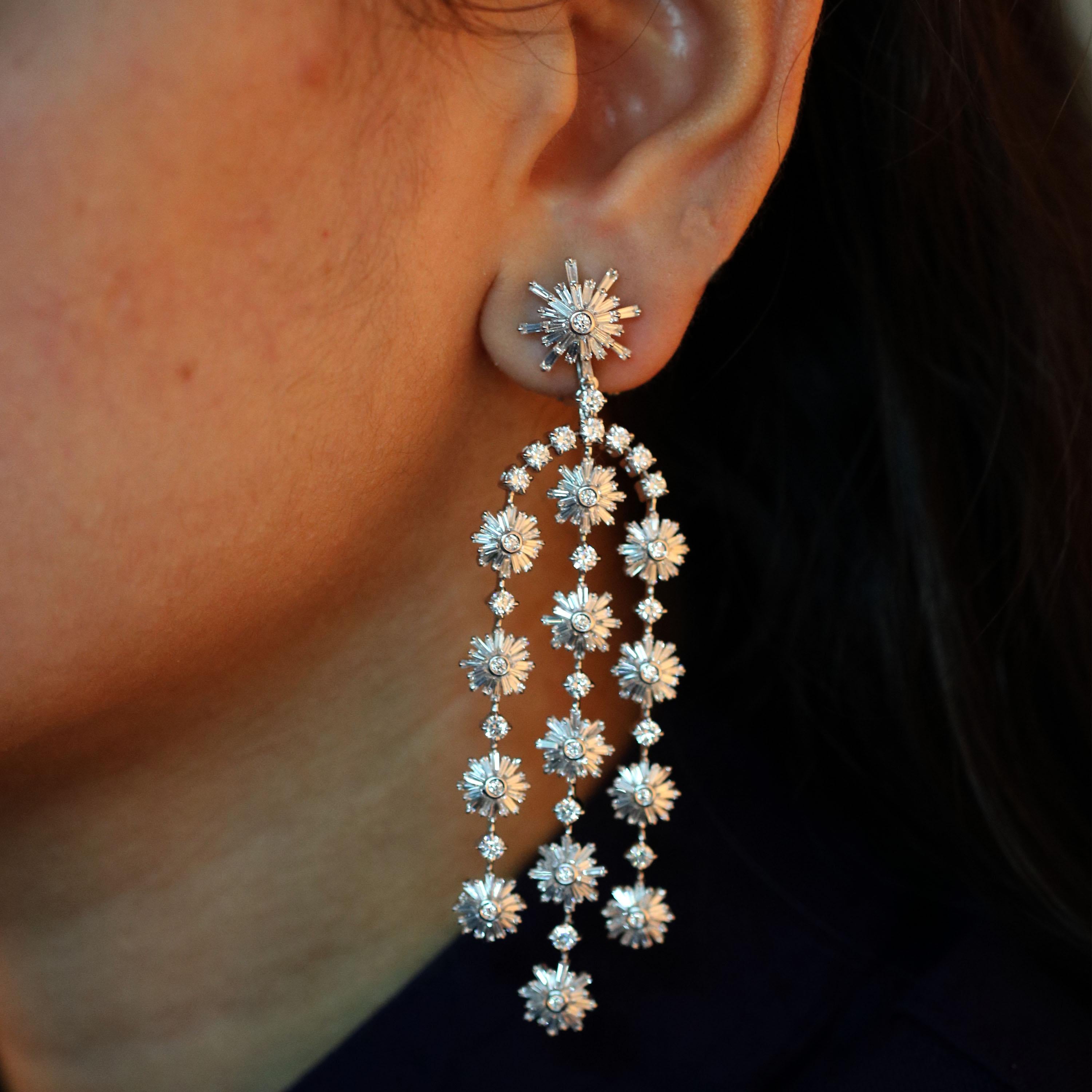 Gross Weight: 29.46 gms
Diamond Weight: 7.63 cts
IGI Certification can be done on request

Video of the product can be shared on Request.

Delicate and intricate like a snowflake, this 18K white gold earrings is frosted with tapers and round
