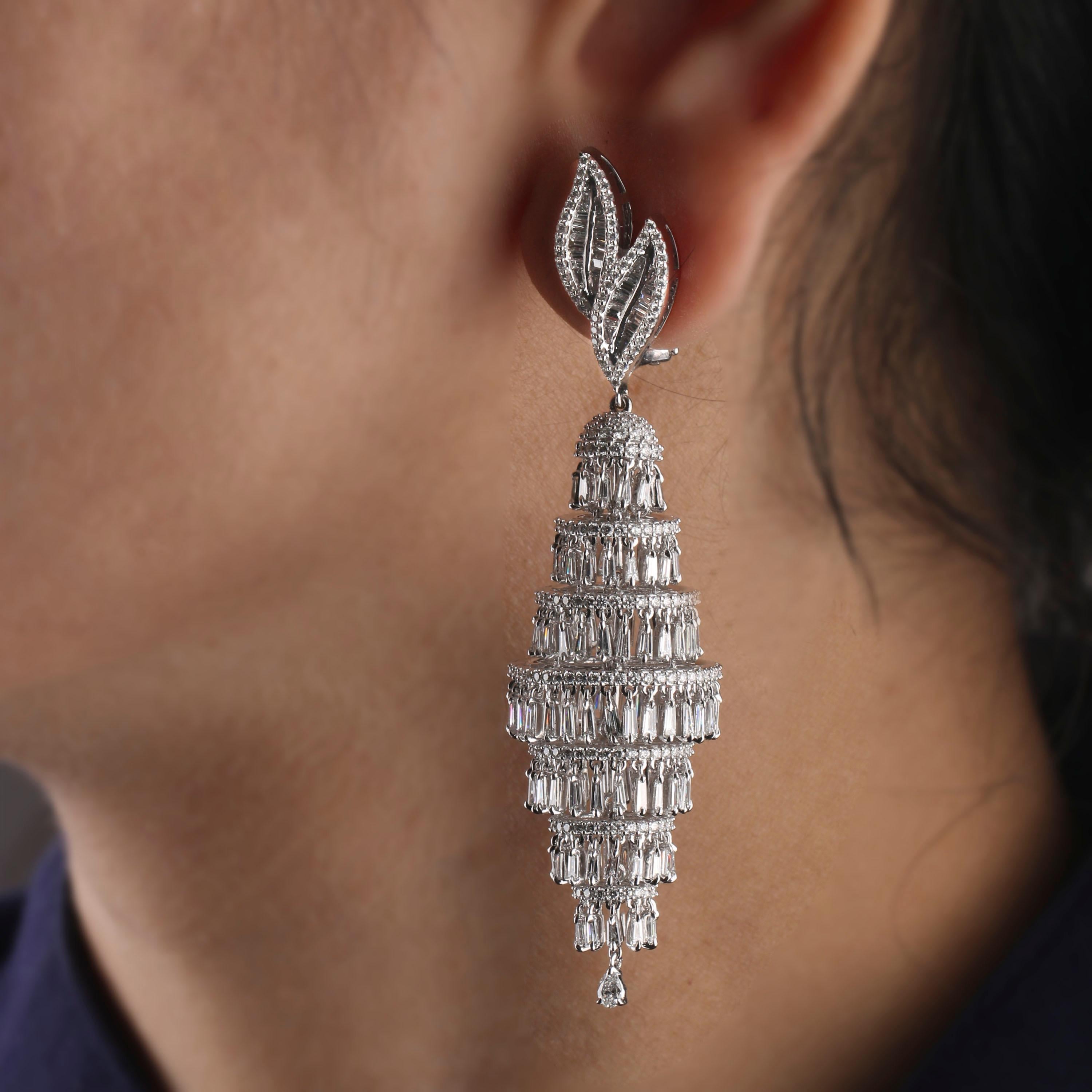 Gross Weight: 34.69 Grams
Diamond Weight: 7.98 cts
IGI Certification can be done on request

Video of the product can be shared upon request.

Set in 18 karat white gold, swinging from diamond studded leaves, these chandelier earrings are a diamond