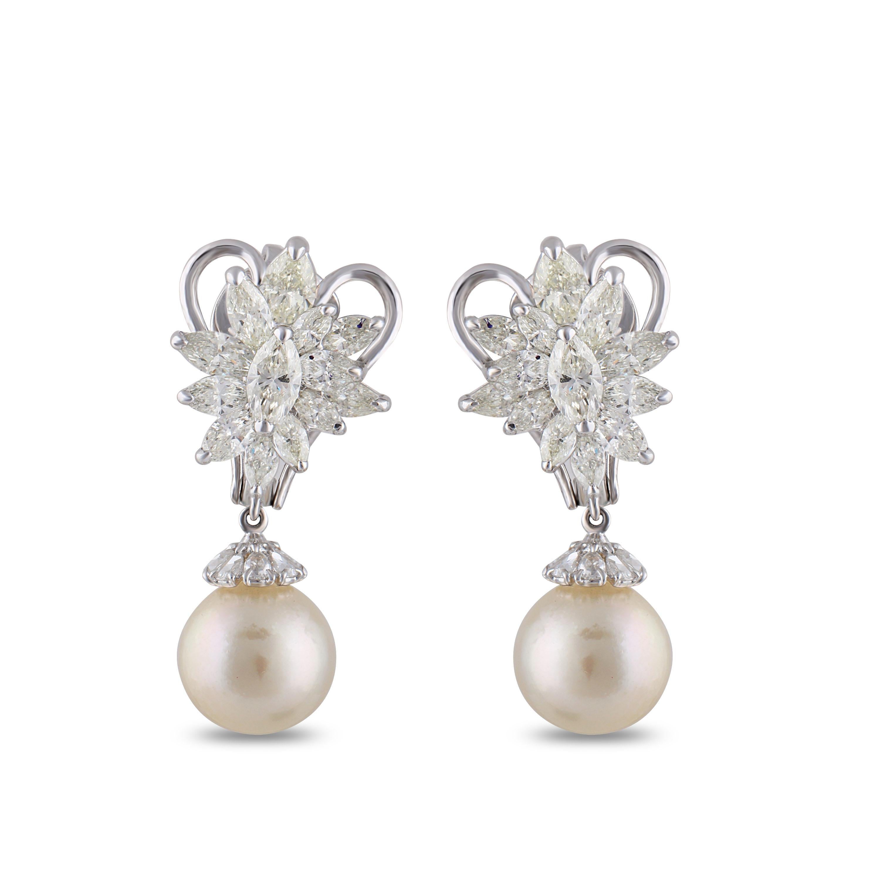 Delicate flowers with calming pearl drops make up this beautiful pair of 18K white gold earrings that are carefully studded with brilliant cut marquise, pear rose cut diamonds and south sea pearls in a prong setting. Its simplicity is its crowning
