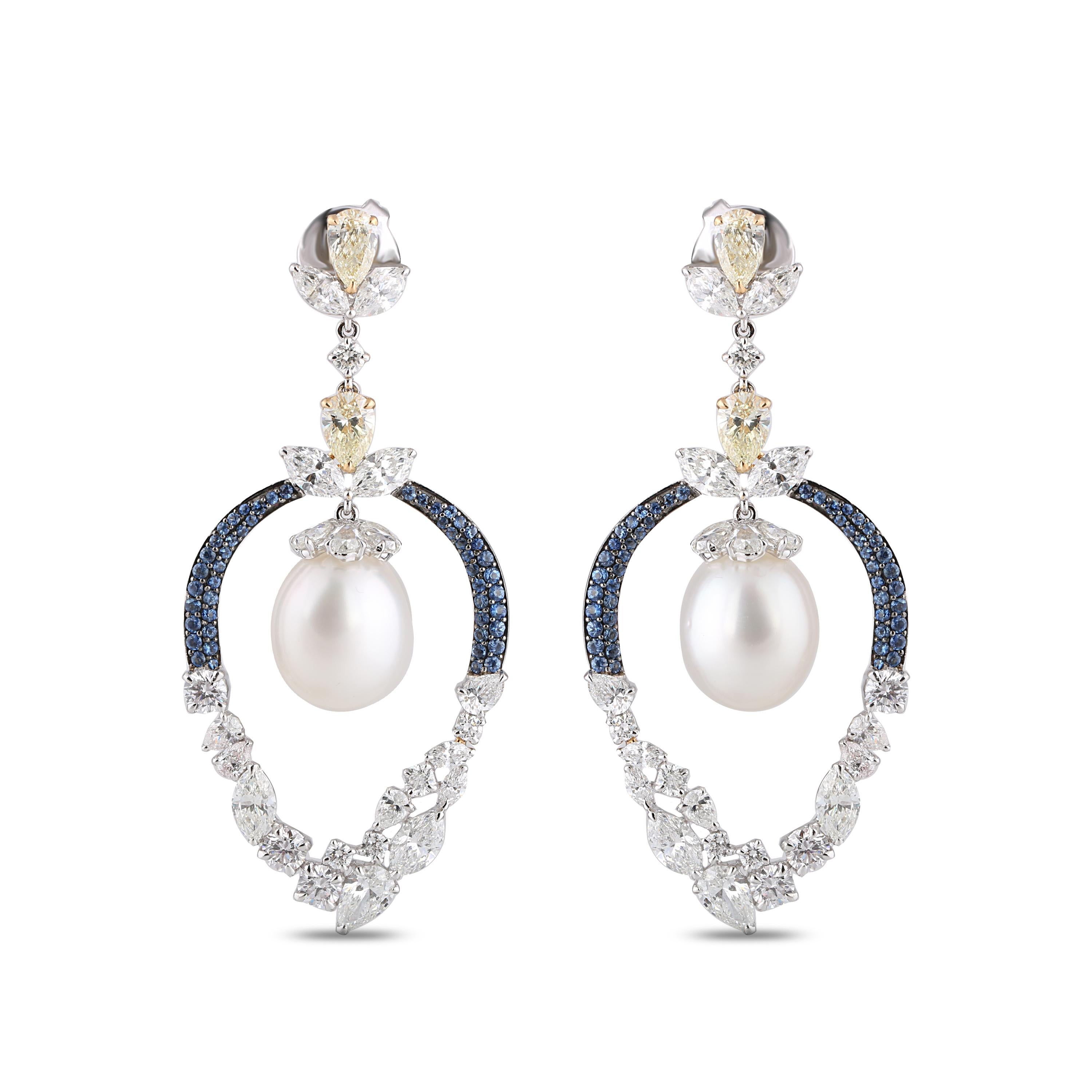 Brilliant cut and rosecut diamonds, south sea pearls and blue sapphire earrings

Add flair to your jewelry box with these masterfully handcrafted chandelier earrings set in 18k white gold. The brilliant cut and rosecut diamonds are artistically