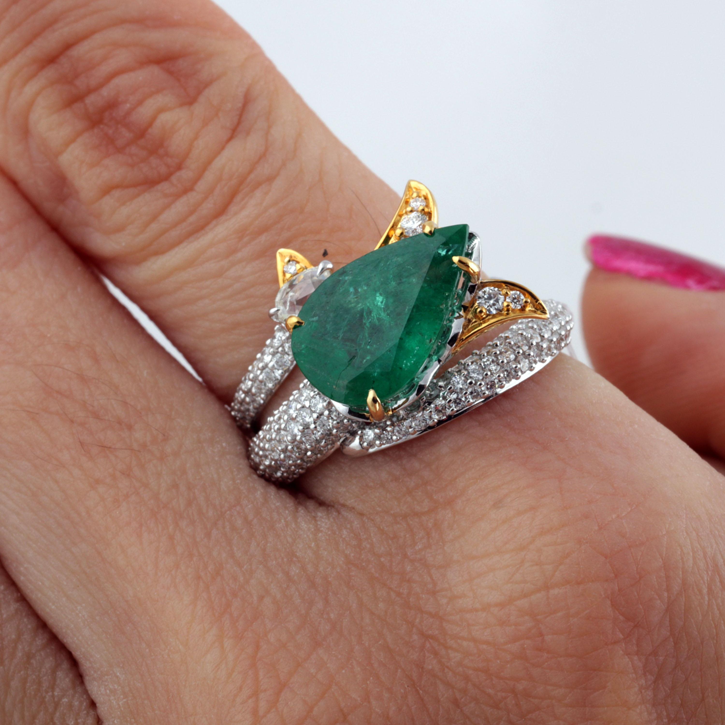 Gross Weight: 7.55 Grams
Diamond Weight: 1.01 cts
Emerald Weight: 3.22 cts
Ring Size: 16.80/ US 6.5 (Resizing Can be Done)
IGI Certified: Summary No.: 15J8652519

Video of the product can be shared on Request.

This 18K white and yellow gold ring