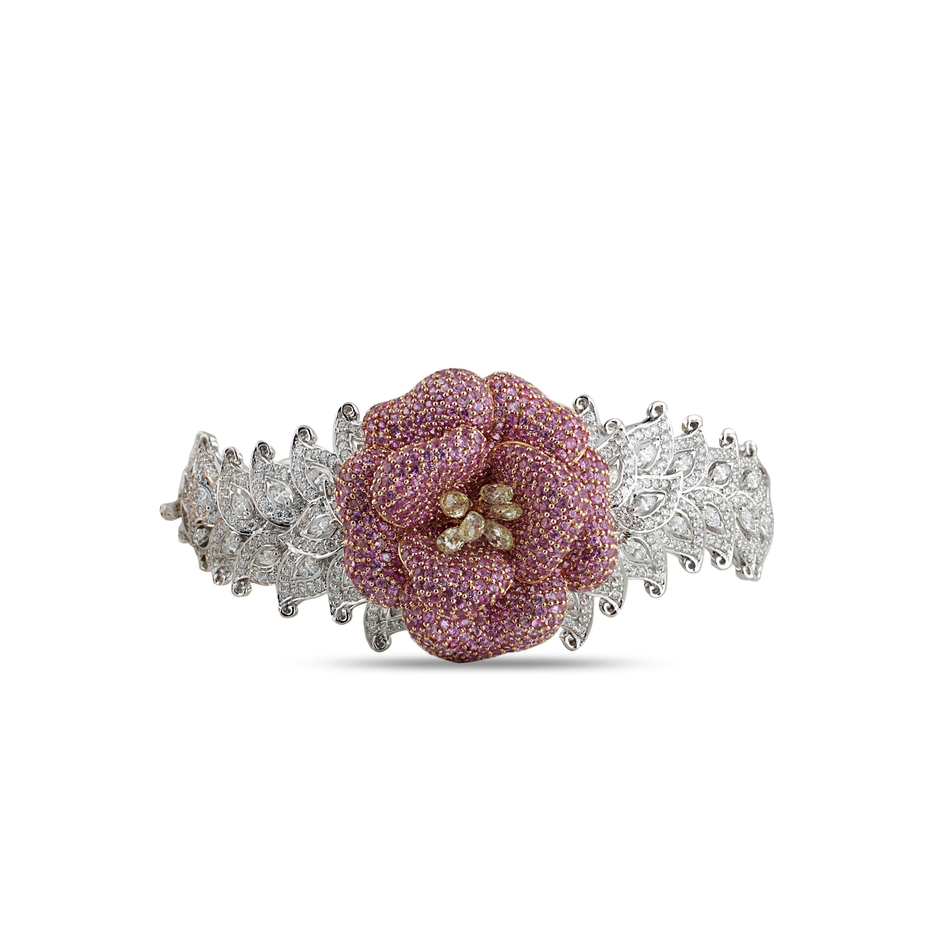 Drawing inspiration from the beauty and charm of nature is this uniquely designed bracelet in 18K white and rose gold, generously adorned with 1,170 stones including yellow briolettes, pink sapphires and marquise and round brilliant cut diamonds.