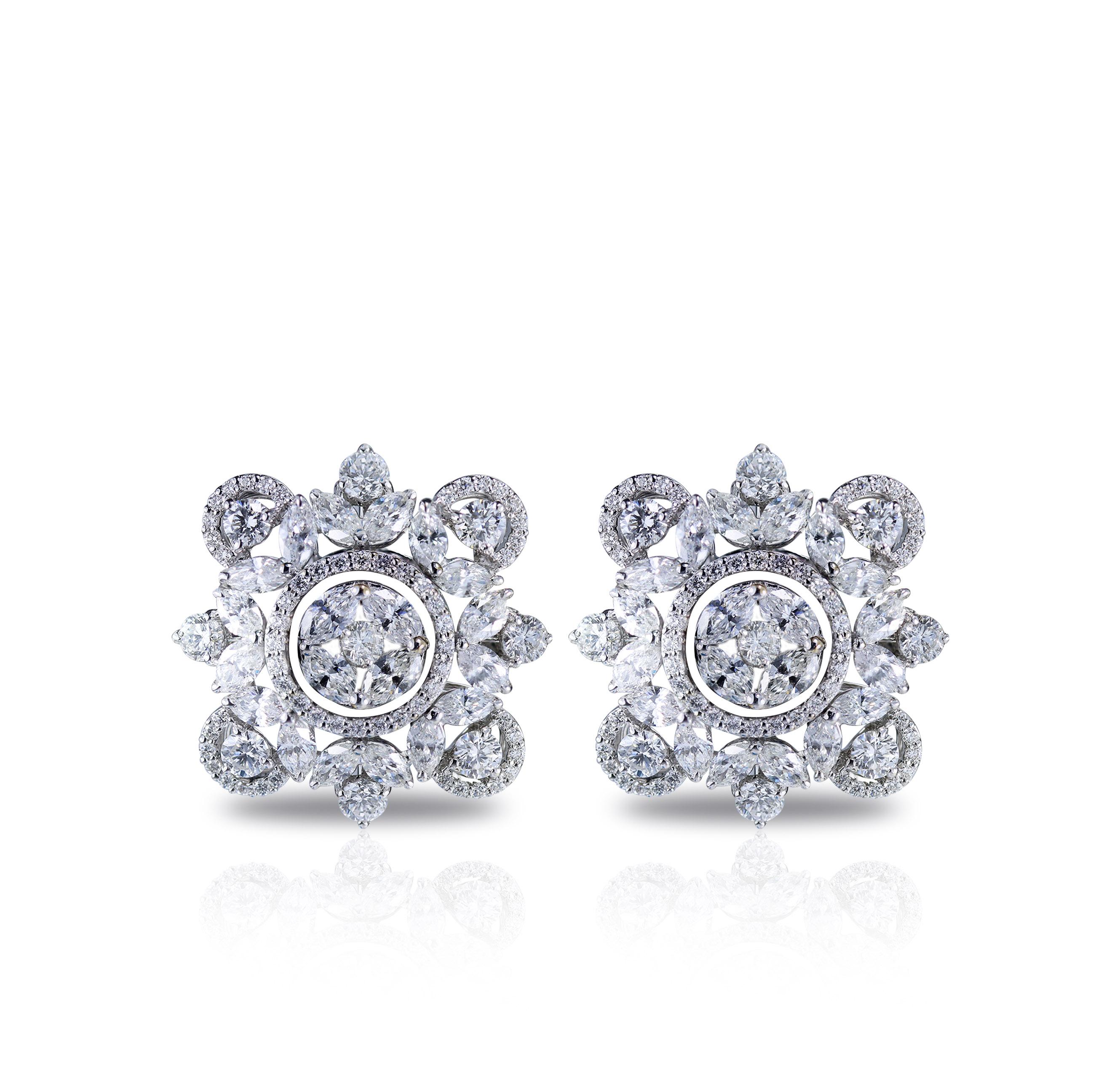 Diamonds are forever, and this 18K white gold earrings studded with round and marquise and brilliant cut diamonds in a prong setting is testimony to the fact. Artfully handcrafted by our craftsmen, it brings together varied diamond shapes in an