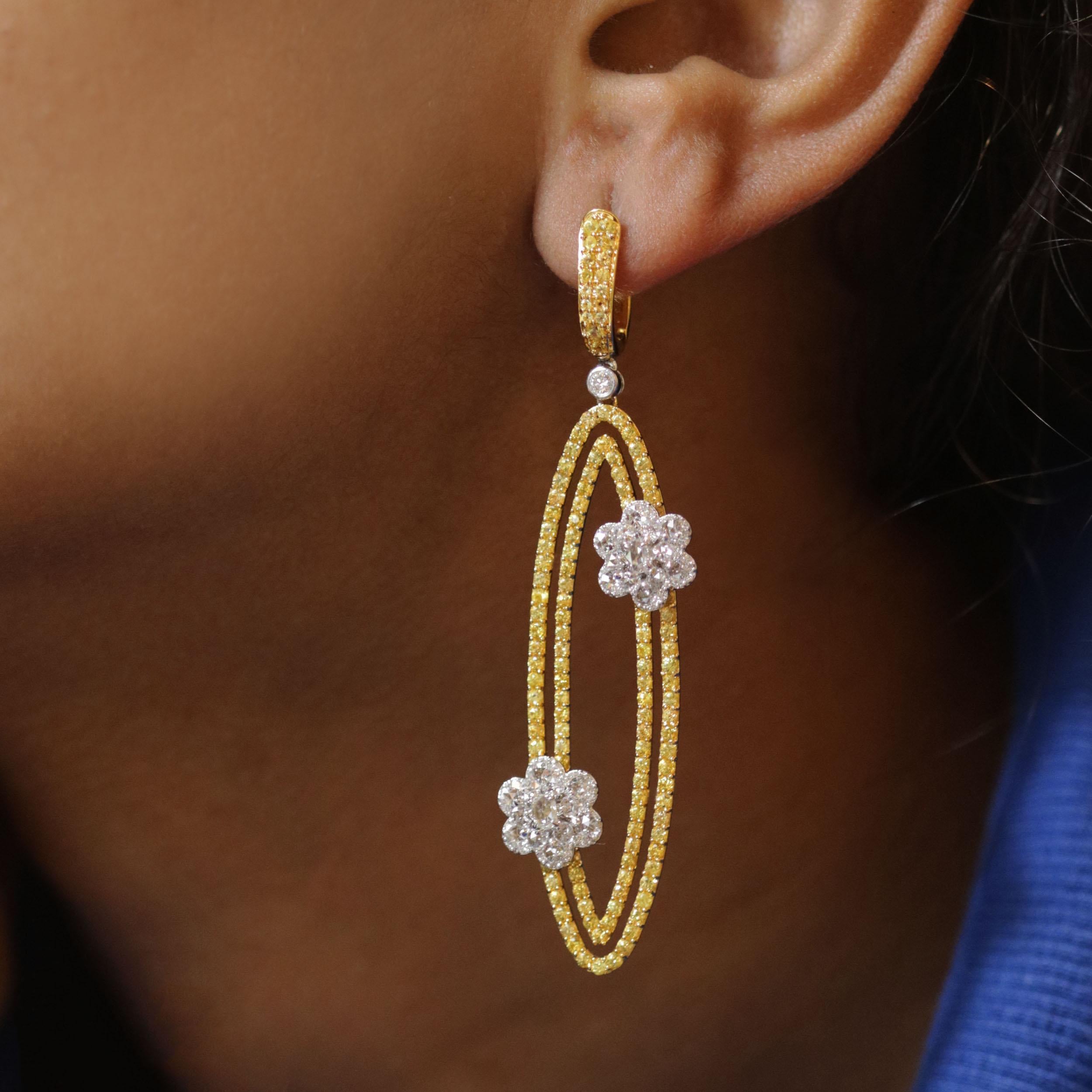 Gross Weight: 20.11 Grams
Diamond Weight: 1.95 cts
Yellow Sapphire Weight: 5.02 cts
IGI Certified: Summary No: 29J388971810

Video of the product can be shared on request.

Geometry and nature inspirations come together in these earrings that are