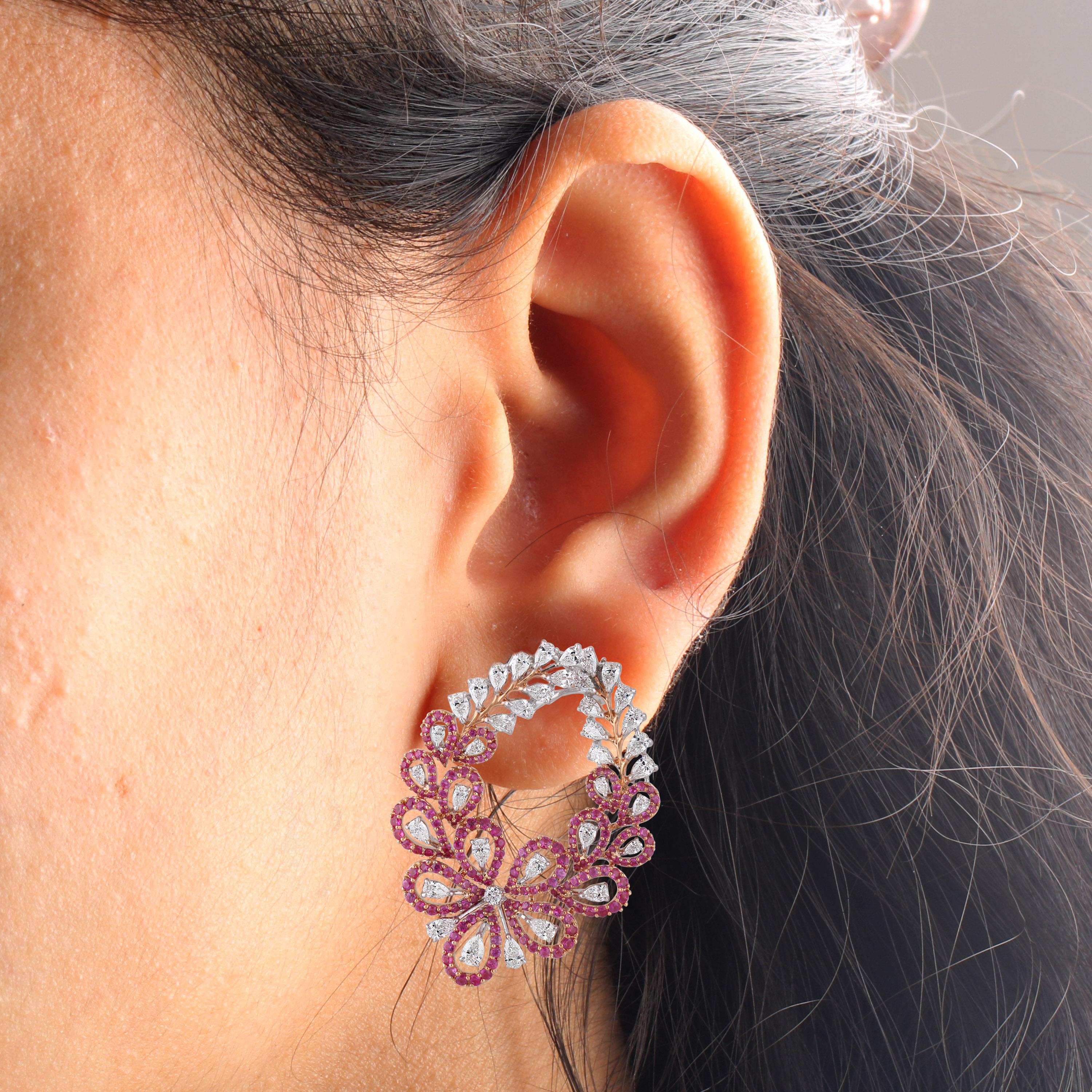 Gross Weight: 28.35 gms
Diamond Weight: 4.79 cts
Pink Sapphire Weight: 4.50 cts
IGI Certified

Video of the product can be shared on request.

18 karat white and rose gold brings out the sparkle of diamonds and pink sapphires in these stud earrings.