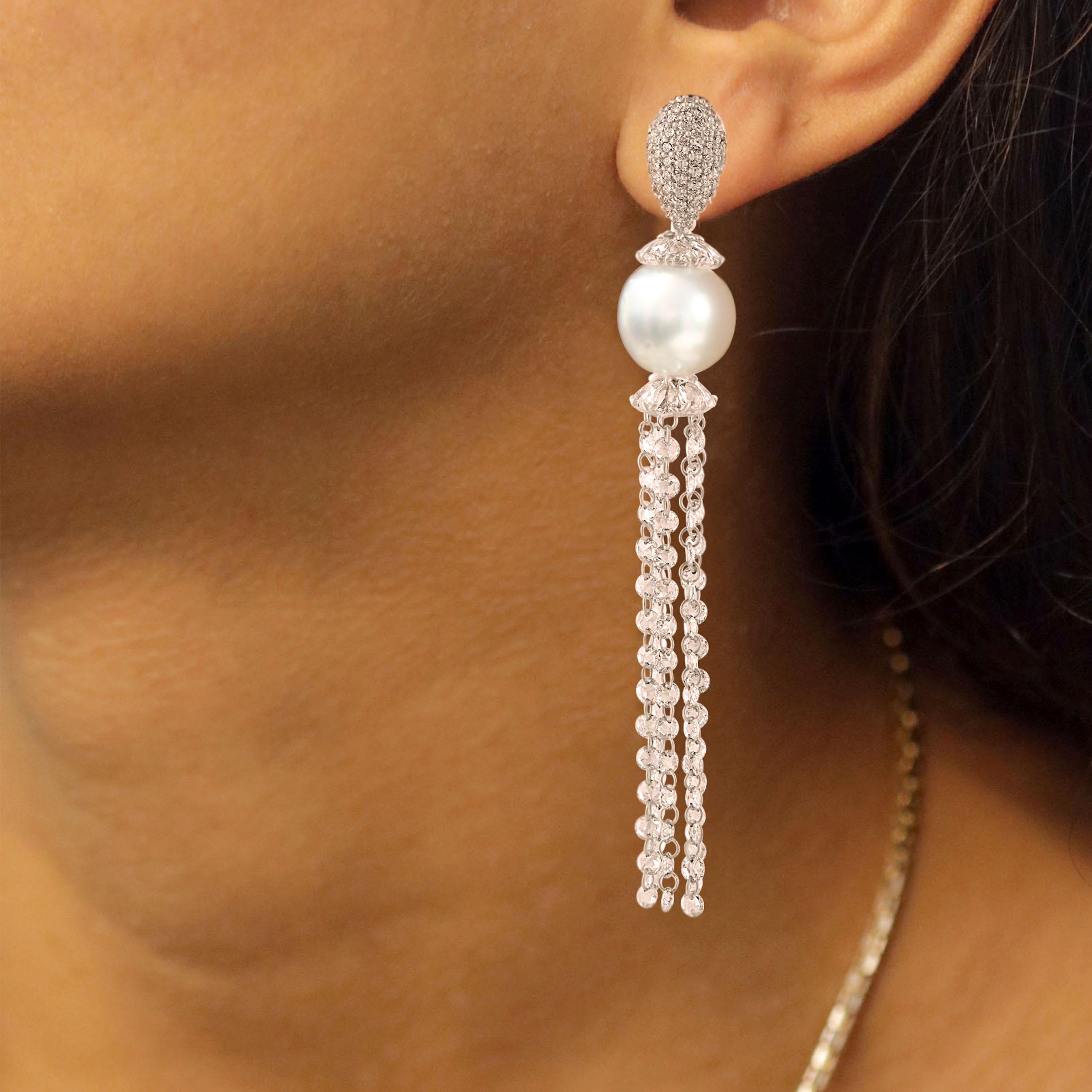 Gross Weight: 9.82 Grams
Diamond Weight: 4.85 cts
South Sea Pearls Weight: 14.78 cts
IGI Certification can be done on request.

Video of the product can be shared on request.

Investing in this heirloom-worthy 18K white gold pair of earrings with