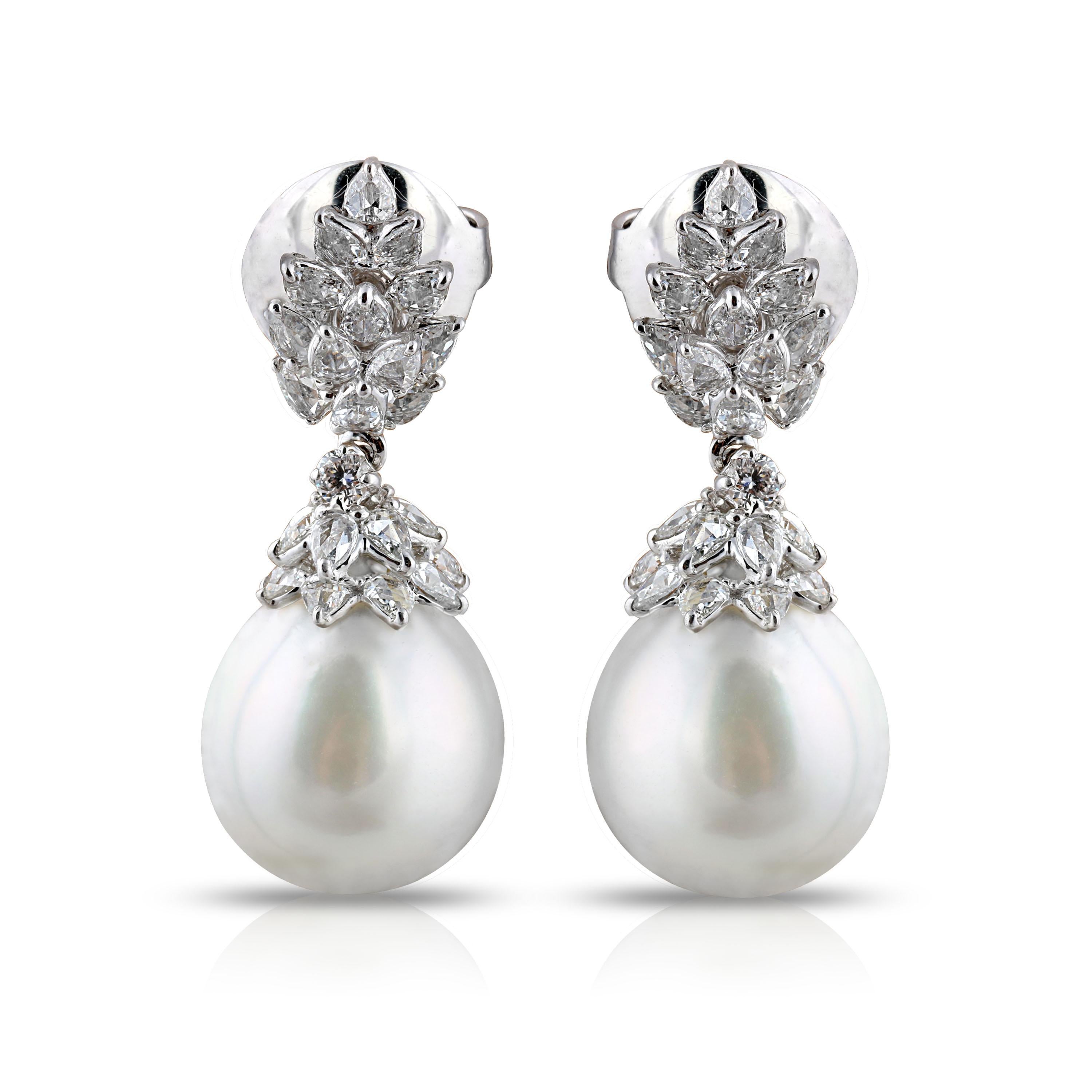 South Sea pearls and rosecut diamond earrings

This pair of 18K white gold earrings adorned with South Sea pearls and pear rose cut and round brilliant cut diamonds in a prong setting is just what you need to enhance your repertoire with grace. Its