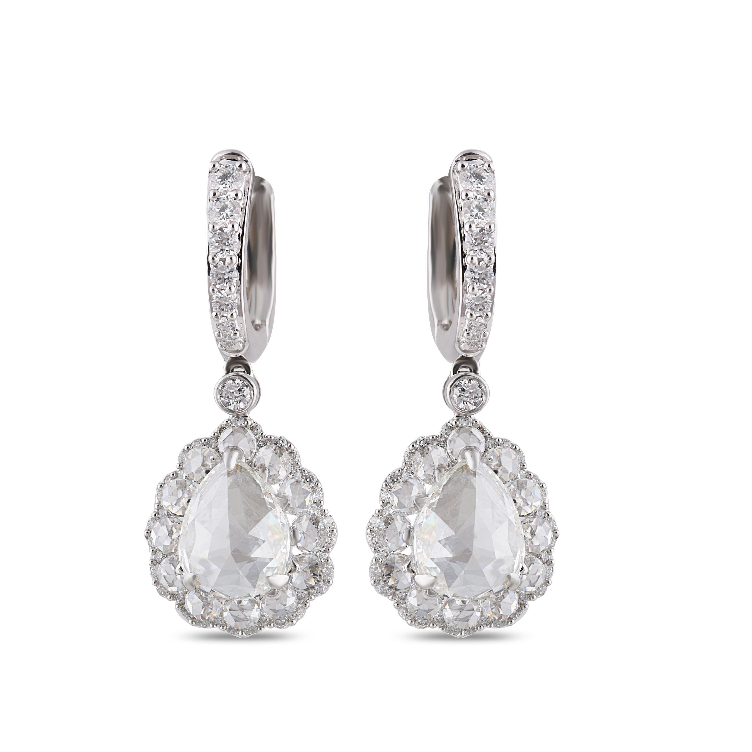 Simple yet charismatic, these 18K white gold earrings beautifully adorned with round brilliant cut diamonds and rose cut diamonds in a prong, pave and drilled setting, are the ultimate lesson in effortless poise. Featuring 116 stones, this delicate