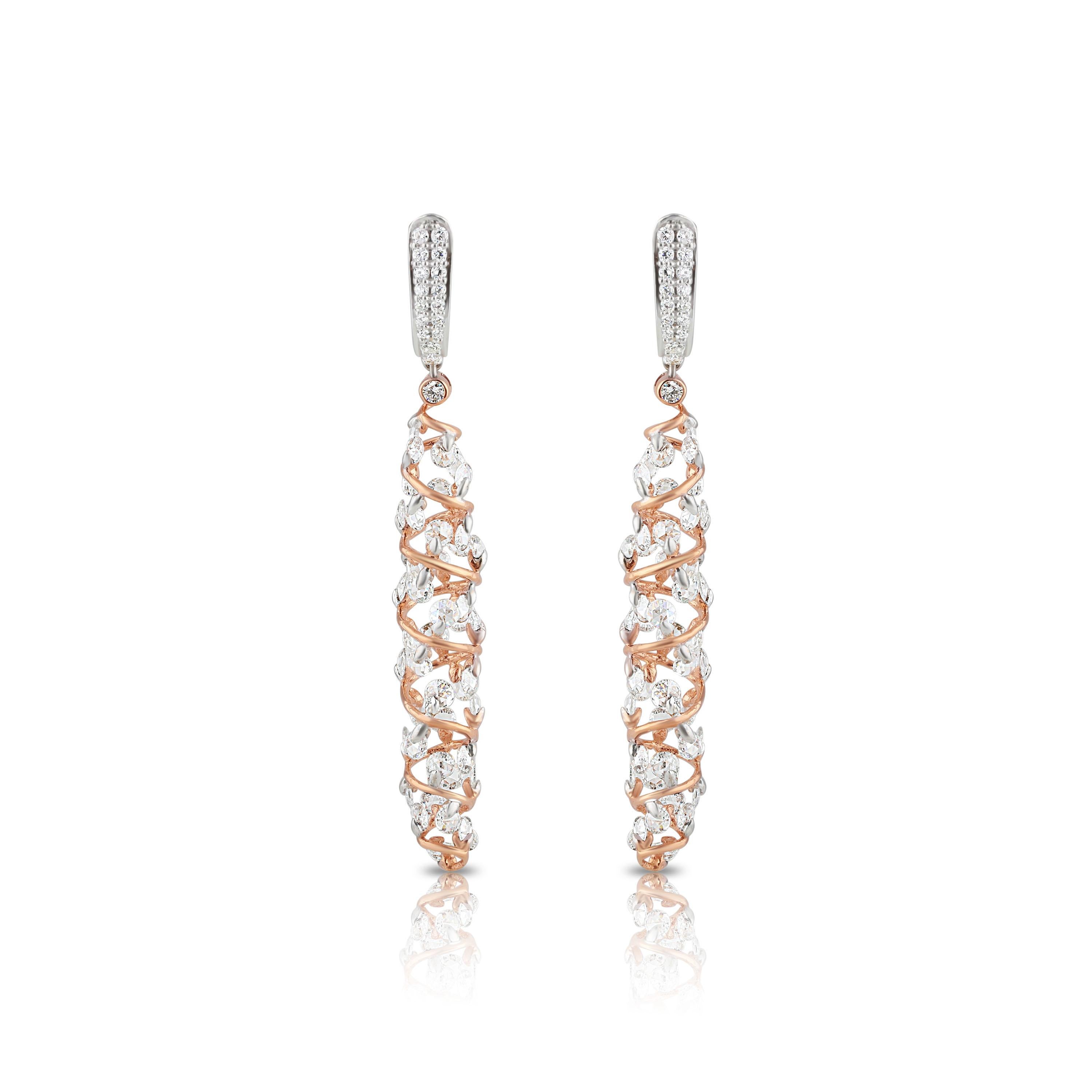 Invest in timelessness and elegance with this pair of 18K white and gold rose earrings featuring round rose cut and round brilliant cut diamonds in a pavé and drill setting. Its contemporary design features 126 stones that are delicately placed