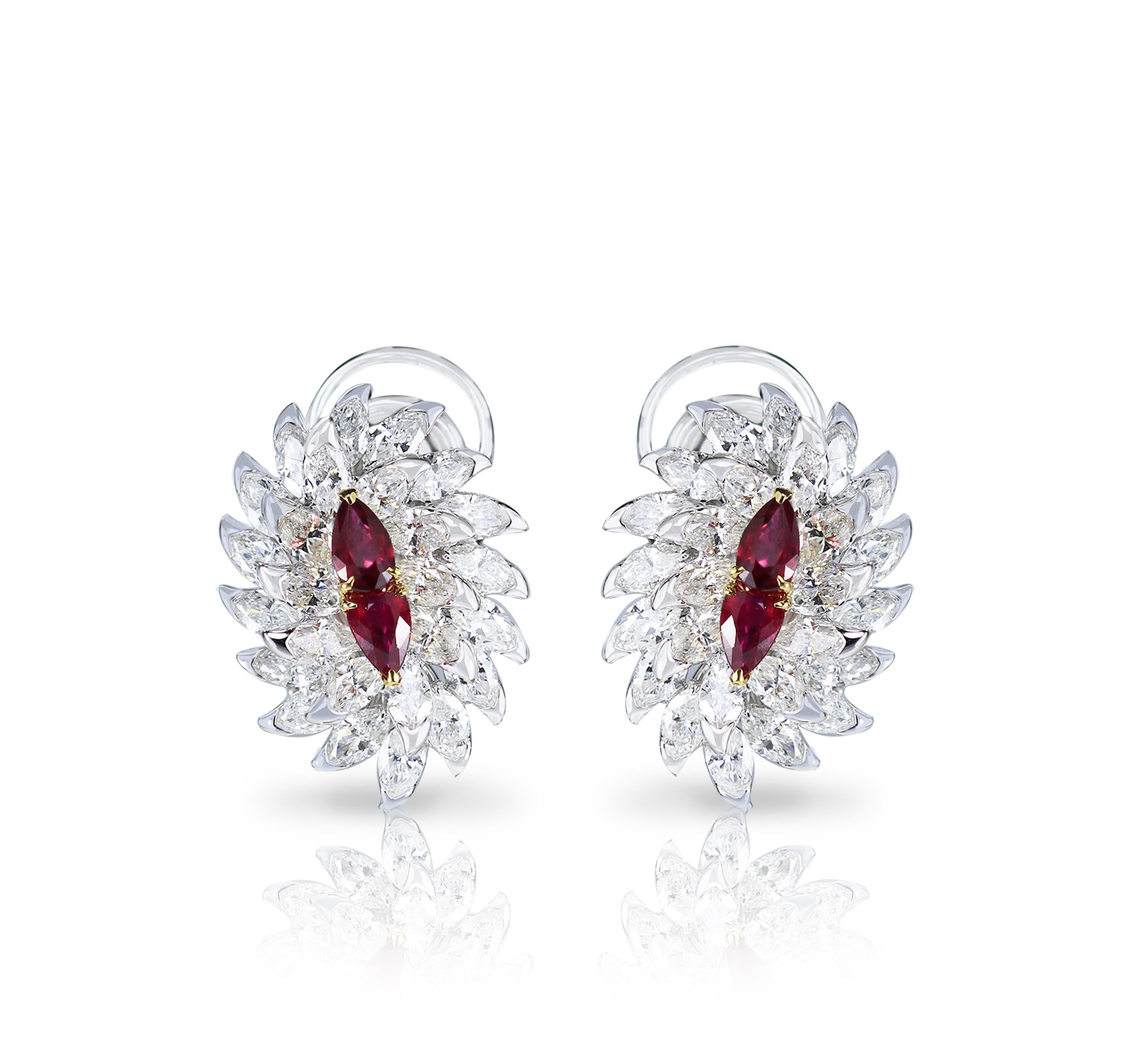 Carefully crafted and exquisitely designed, this pair of 18K white and yellow gold stud earrings studded with brilliant cut marquise diamonds and rubies is elegant and sleek. Featuring 56 stones, this pair is the ideal choice to add a finishing