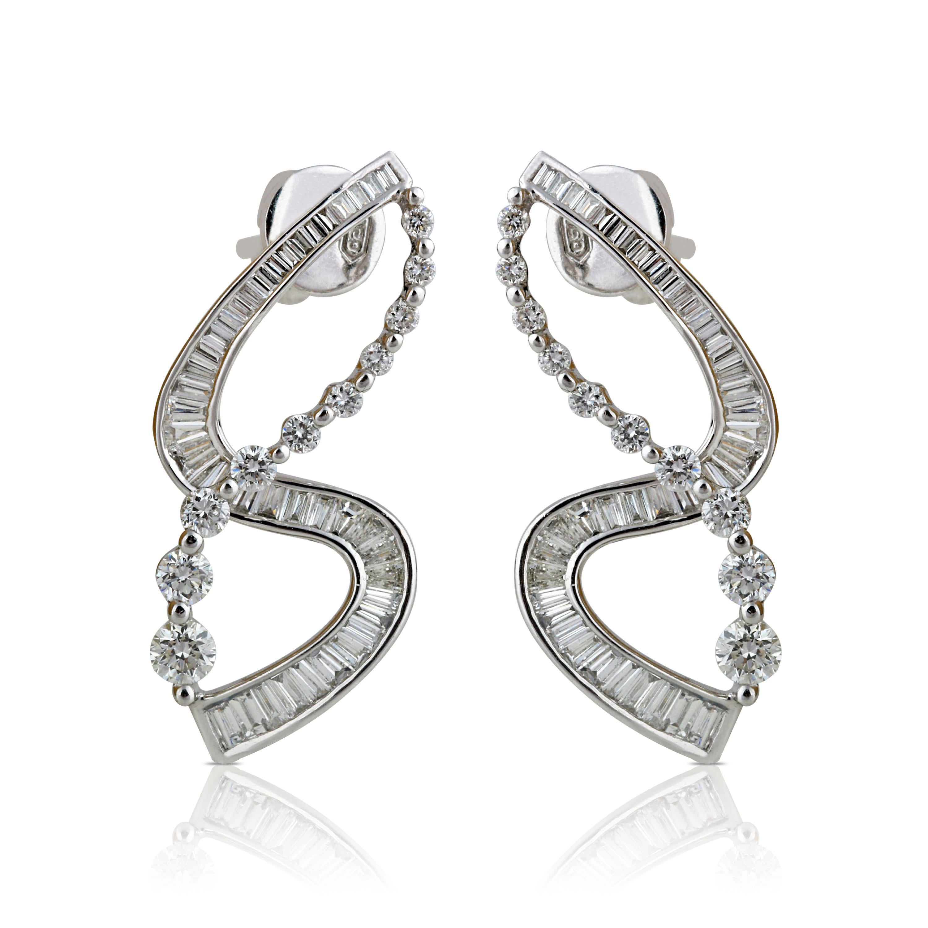 18K white gold and diamond earrings

Crafted with extreme precision in 18K white gold, these earrings with their unique design using round brilliant, baguettes and taper diamonds will perfectly pair with every look in your wardrobe. In a combination