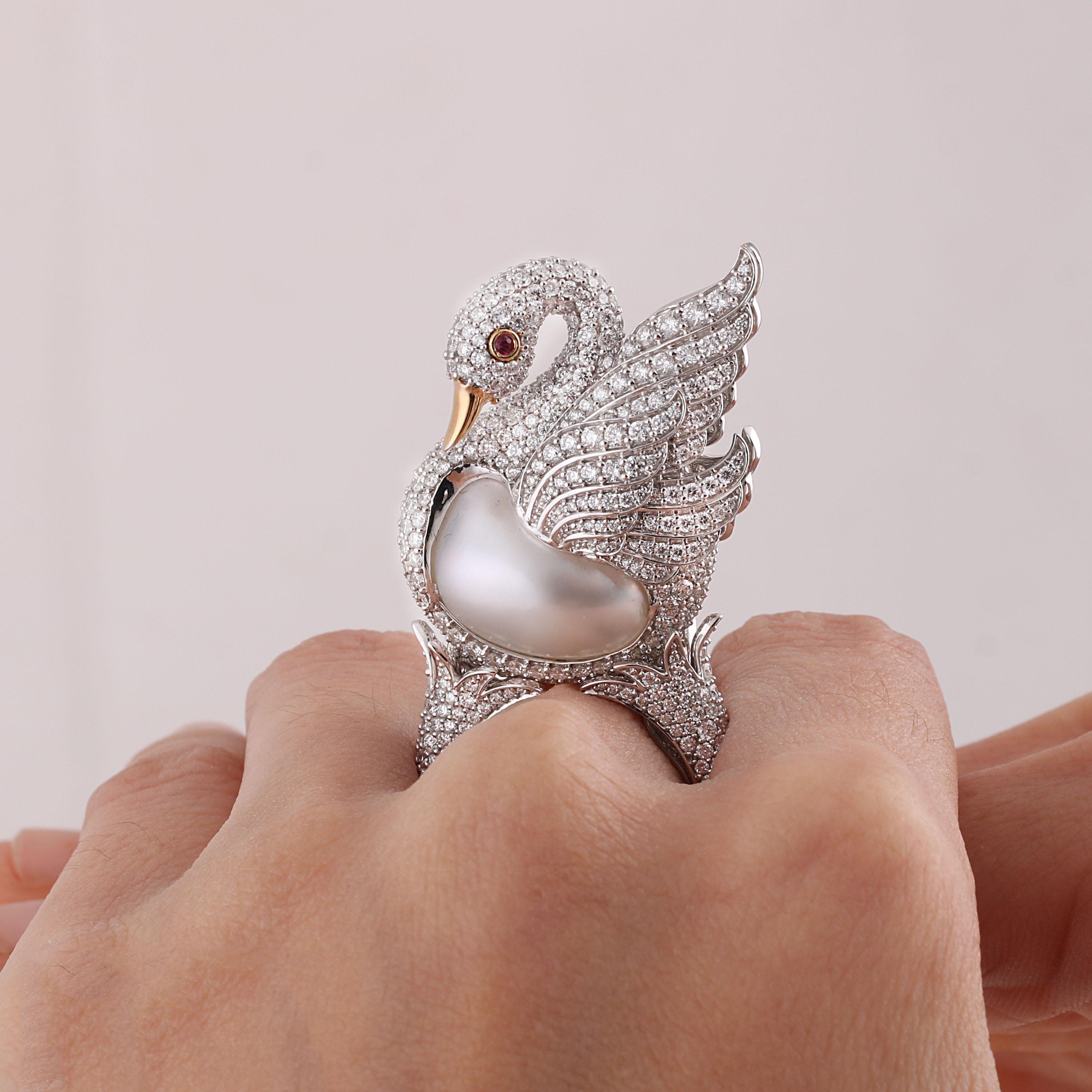 Gross Weight: 23.67 Grams
Diamond Weight: 6.17 cts
Ruby Weight: 0.03 cts
Pearl Weight: 22.47 cts
Ring Size: US 5
IGI Certified

Video of the product can be shared upon request.

This cocktail ring is all you need to spread your wings as a bonafide