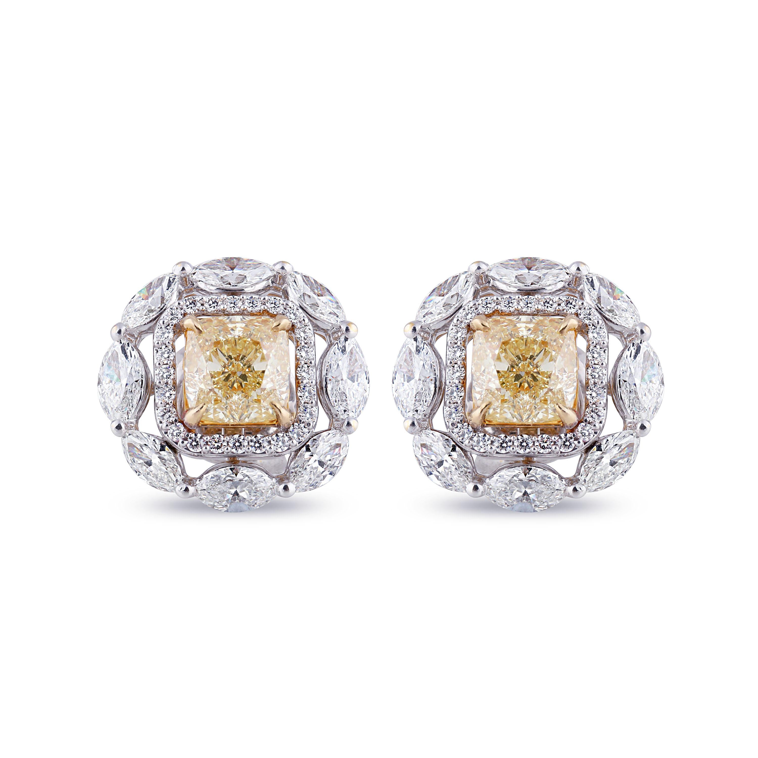 Classic stud earrings are worth the investment when they enamors you. This 18K white and yellow gold earrings studded with round, marquise brilliant cut and yellow cushion cut diamonds in a prong setting does just that. Featuring 68 stones its