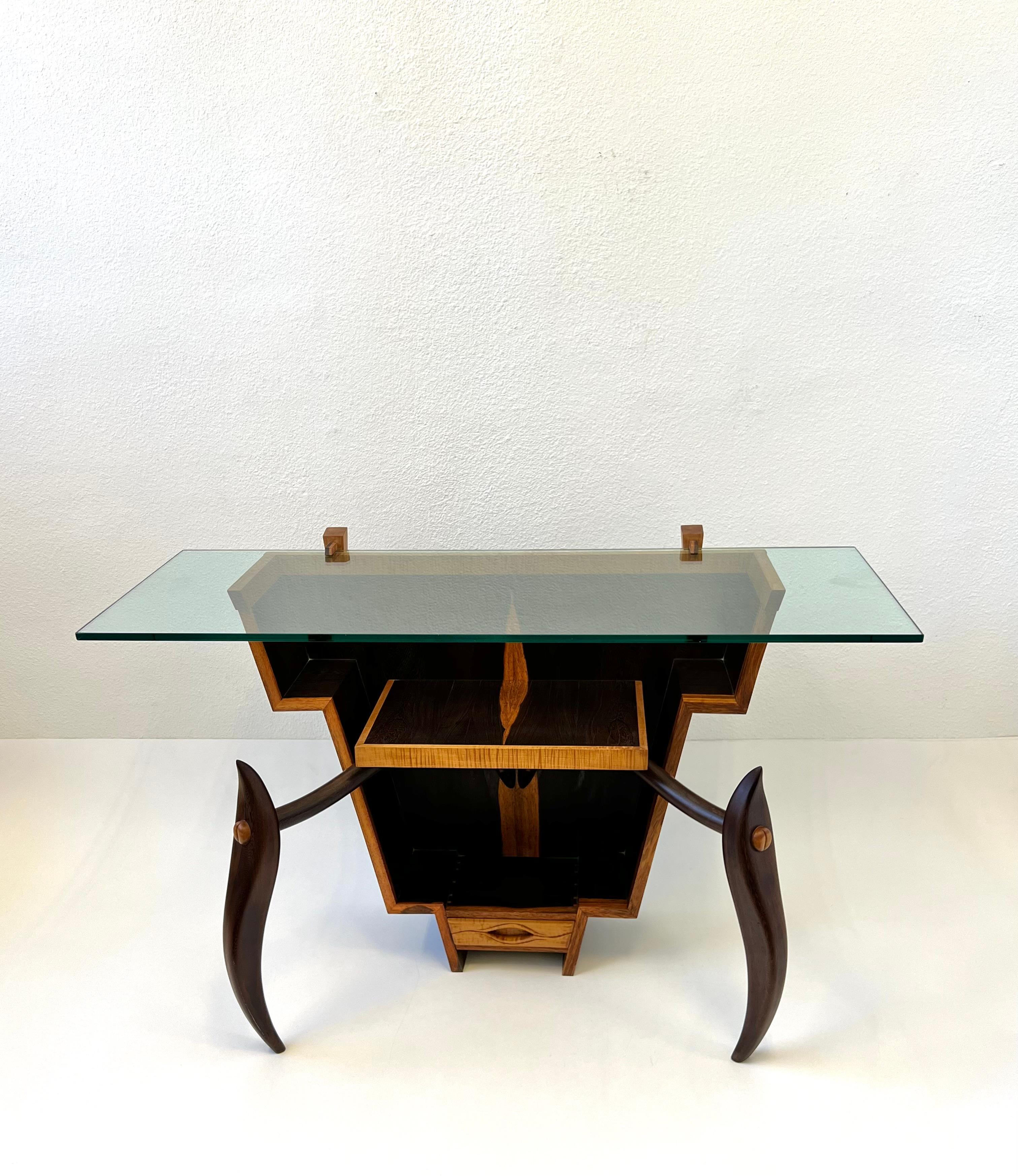 1970’s Sculptural rosewood and zebras wood with glass top console table. 
All hand crafted with dowels no nails. Beautiful use of wood mixture.
It has a small drawer on the bottom. 
In original vintage condition shows minor wear consistent with age.