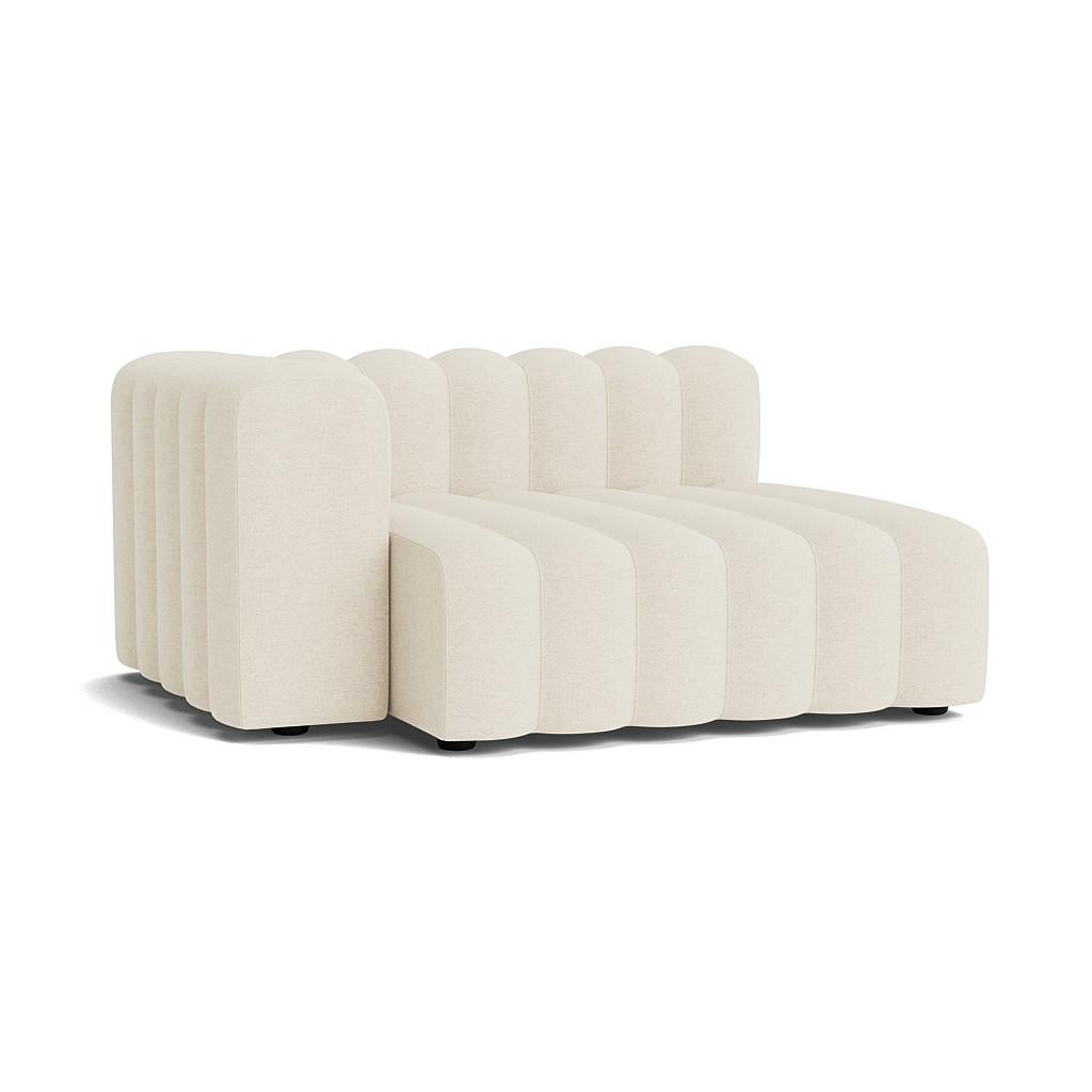 Studio Setup 12 Sofa by NORR11
Dimensions: D 130 x W 353 x H 70 cm. SH 47 cm. 
Materials: Foam, wood and upholstery.
Upholstery: Barnum Boucle Color 24.

Available in different upholstery options. Prices may vary. A plywood structure with elastic