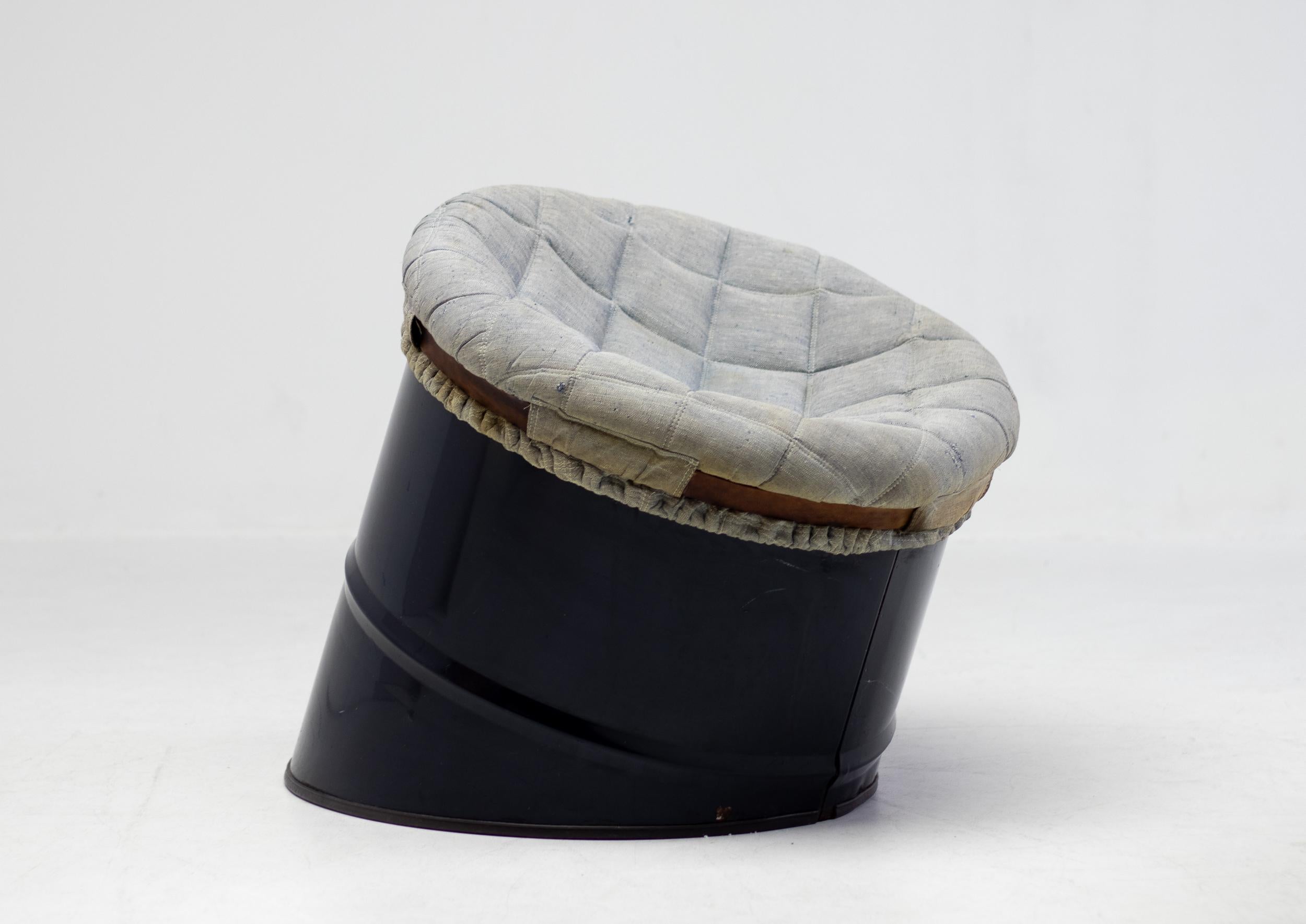 Unique avant-garde piece made by Studio Simon, Italy. 
A dark blue steel oil drum cut diagonally and upholstered with a foam filled seat that is attached to the drum by a leather belt. In all original unrestored condition.
Marked at the bottom of