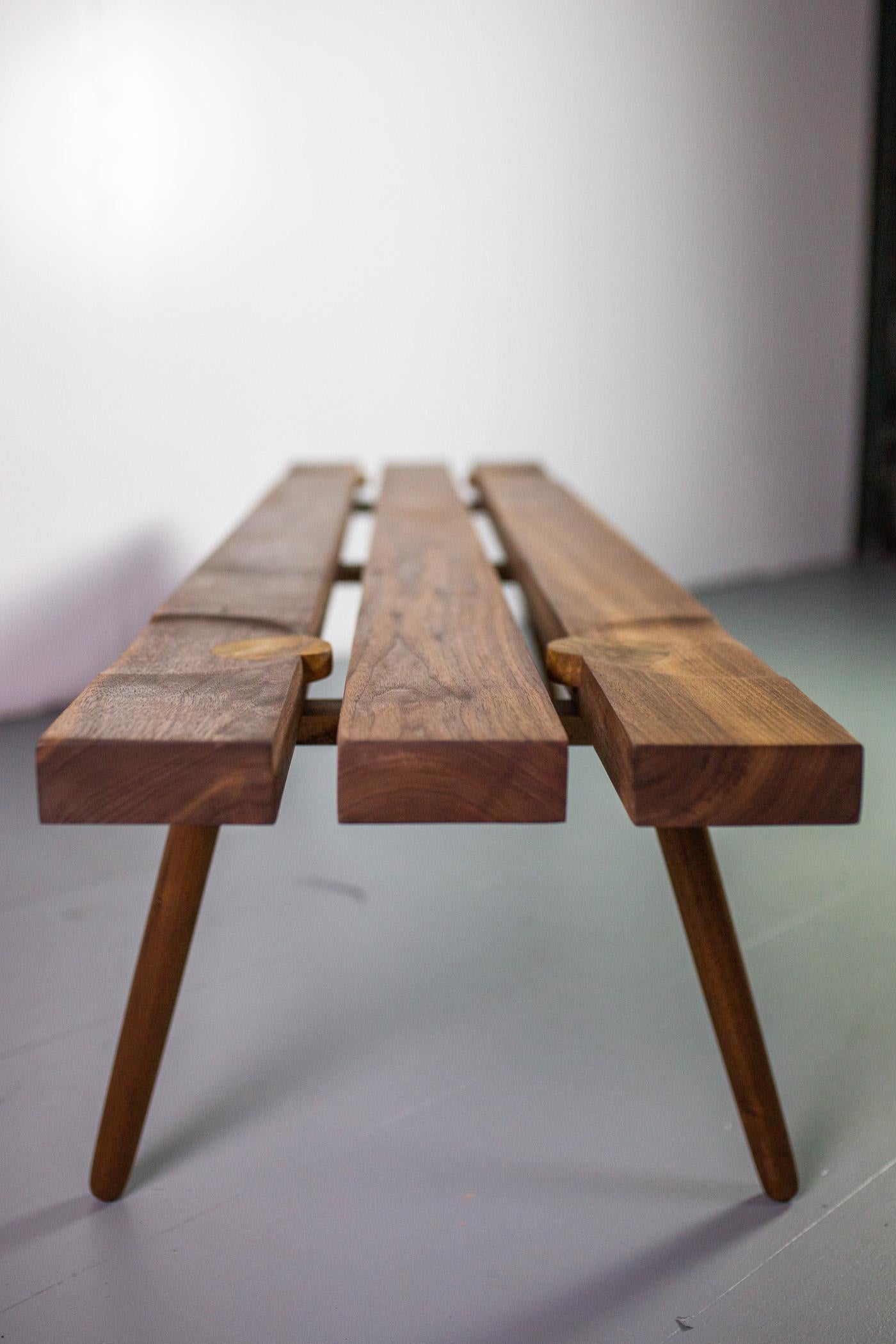 Studio Slat bench by Michael Rozell USA 2020 in walnut and white oak inlays.